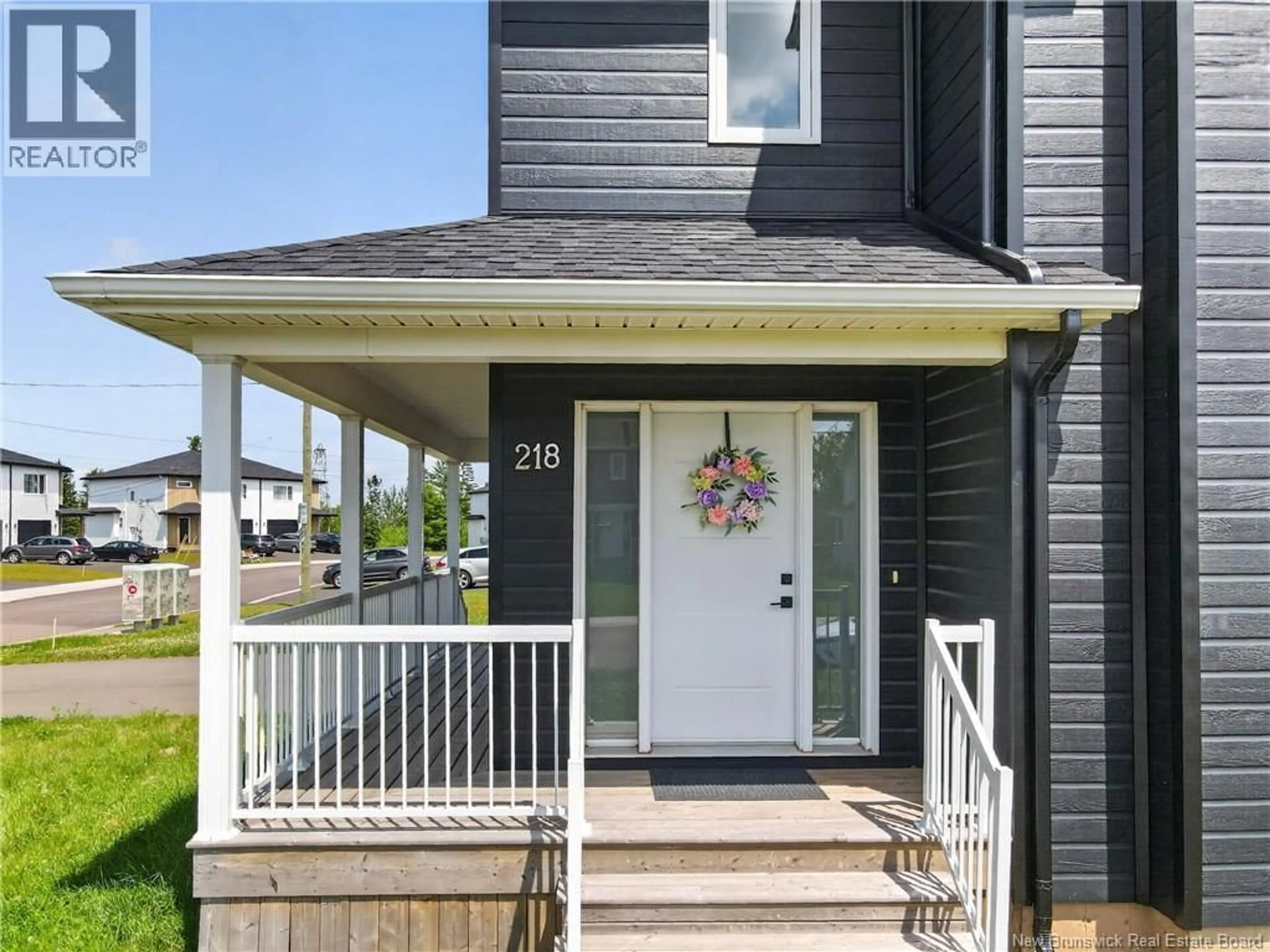 Home with vinyl exterior material, street for 218 FALCON DRIVE, Moncton New Brunswick E1H0H8