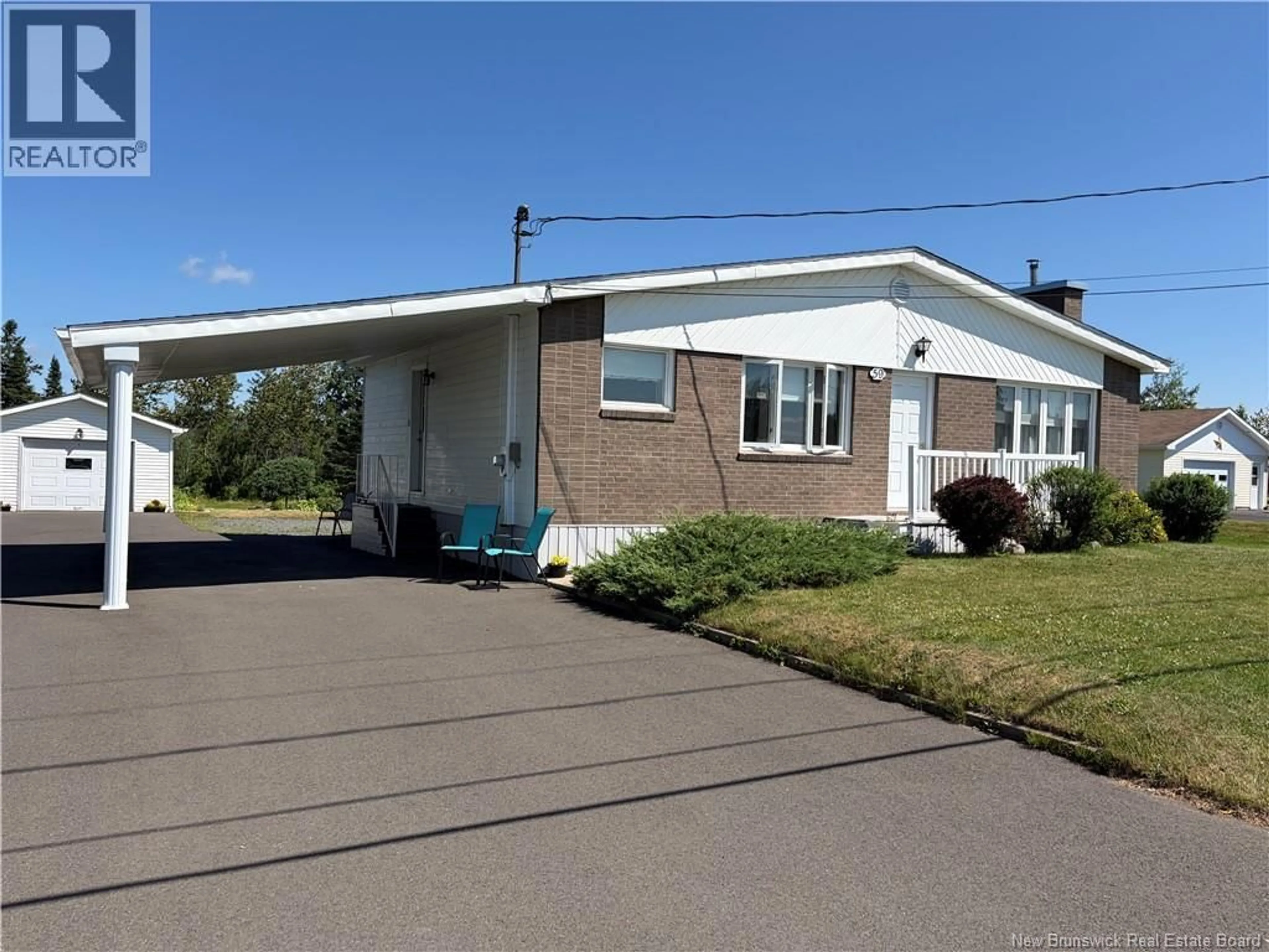 Home with vinyl exterior material, street for 59 RUE DE L'ANSE, Eel River Crossing New Brunswick E8E1P9
