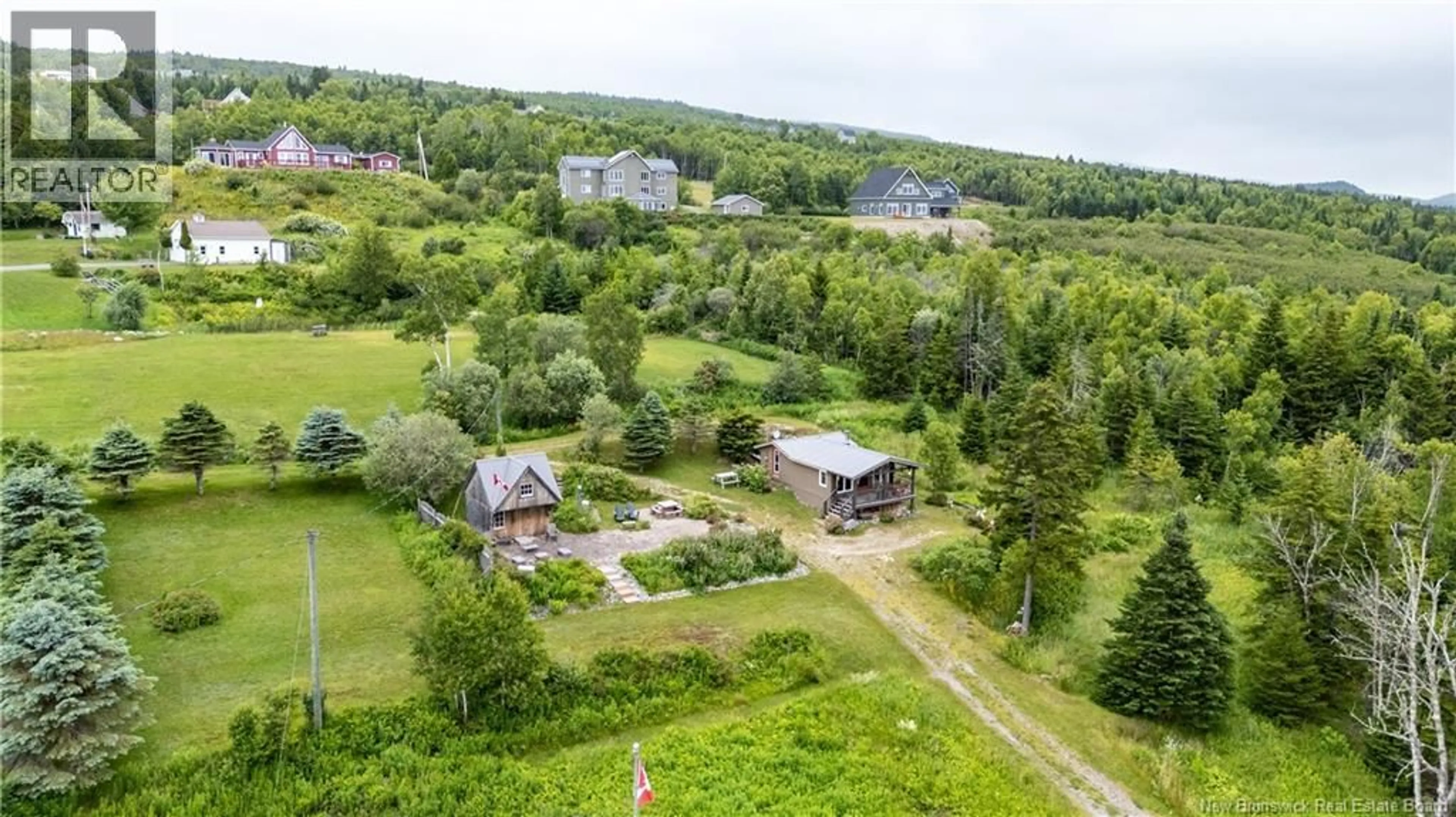 A pic from outside/outdoor area/front of a property/back of a property/a pic from drone, unknown for 100 SCHOOL STREET, Alma New Brunswick E4H1L1