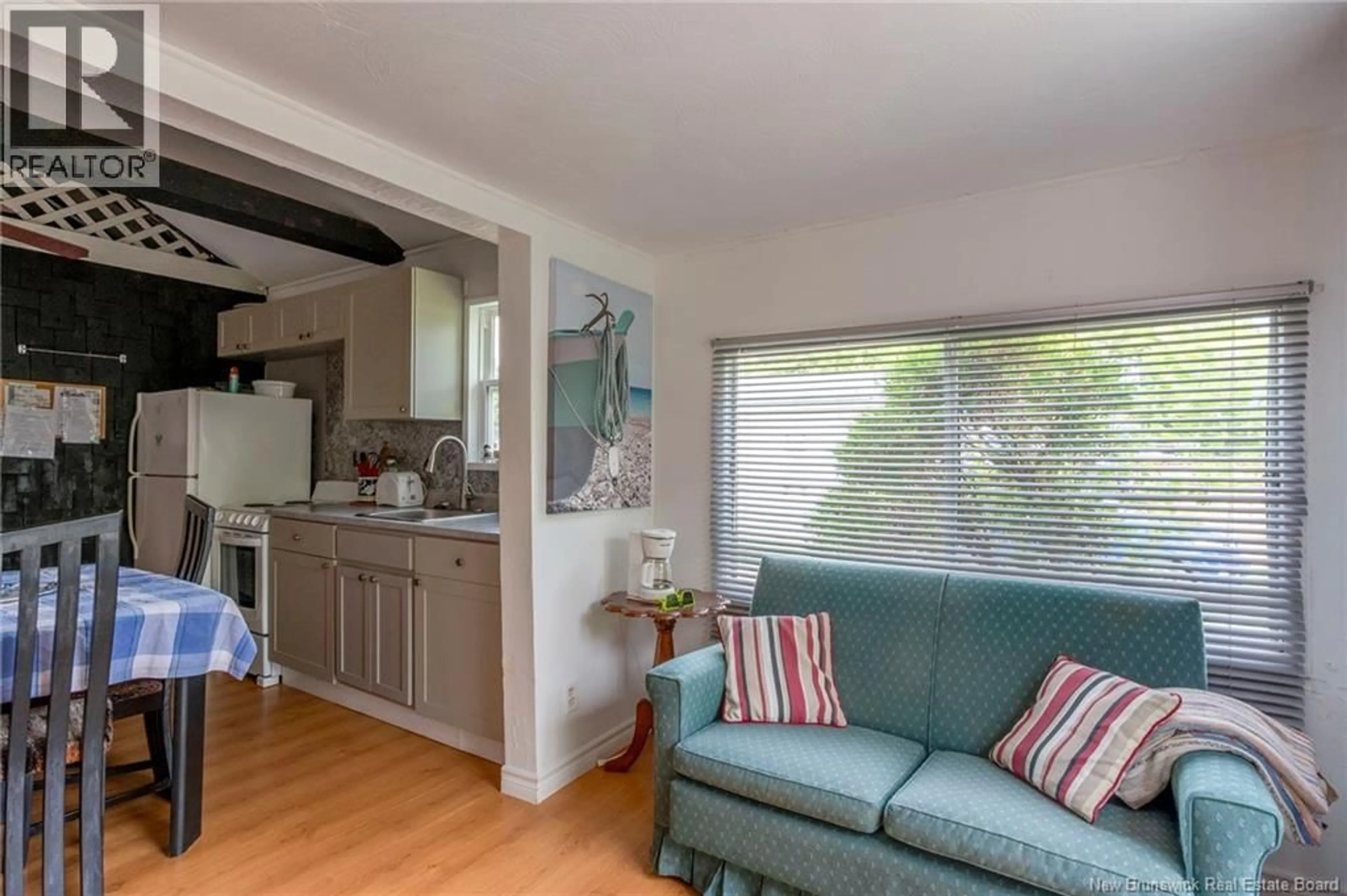 Living room with furniture, wood/laminate floor for 130 ALMA LEBLANC STREET, Grande-Digue New Brunswick E4R4A9