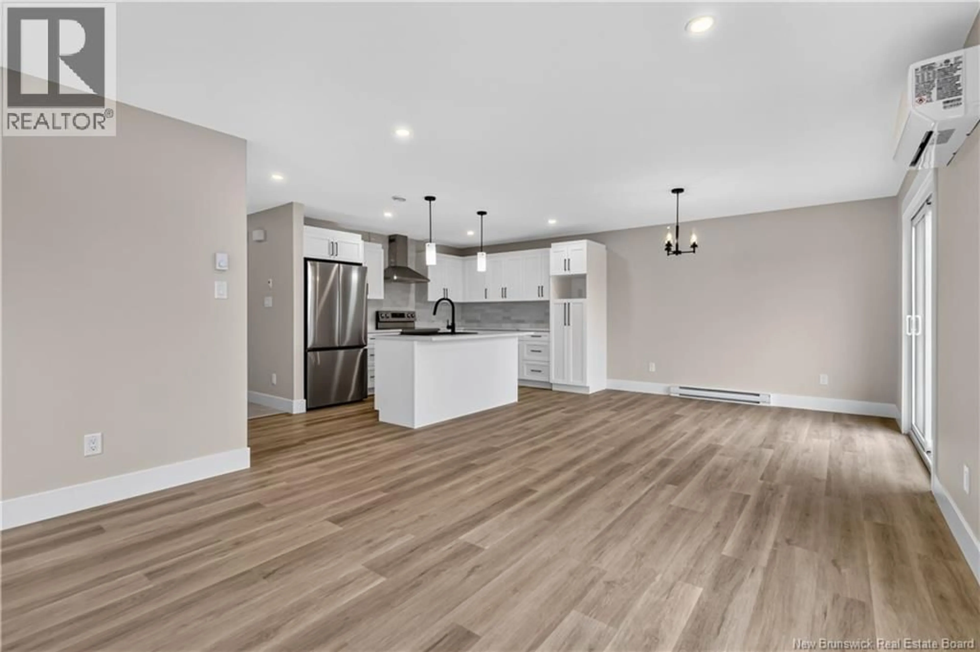 Open concept kitchen, wood/laminate floor for 224-226 MACCOUN STREET, Moncton New Brunswick E1K0A1