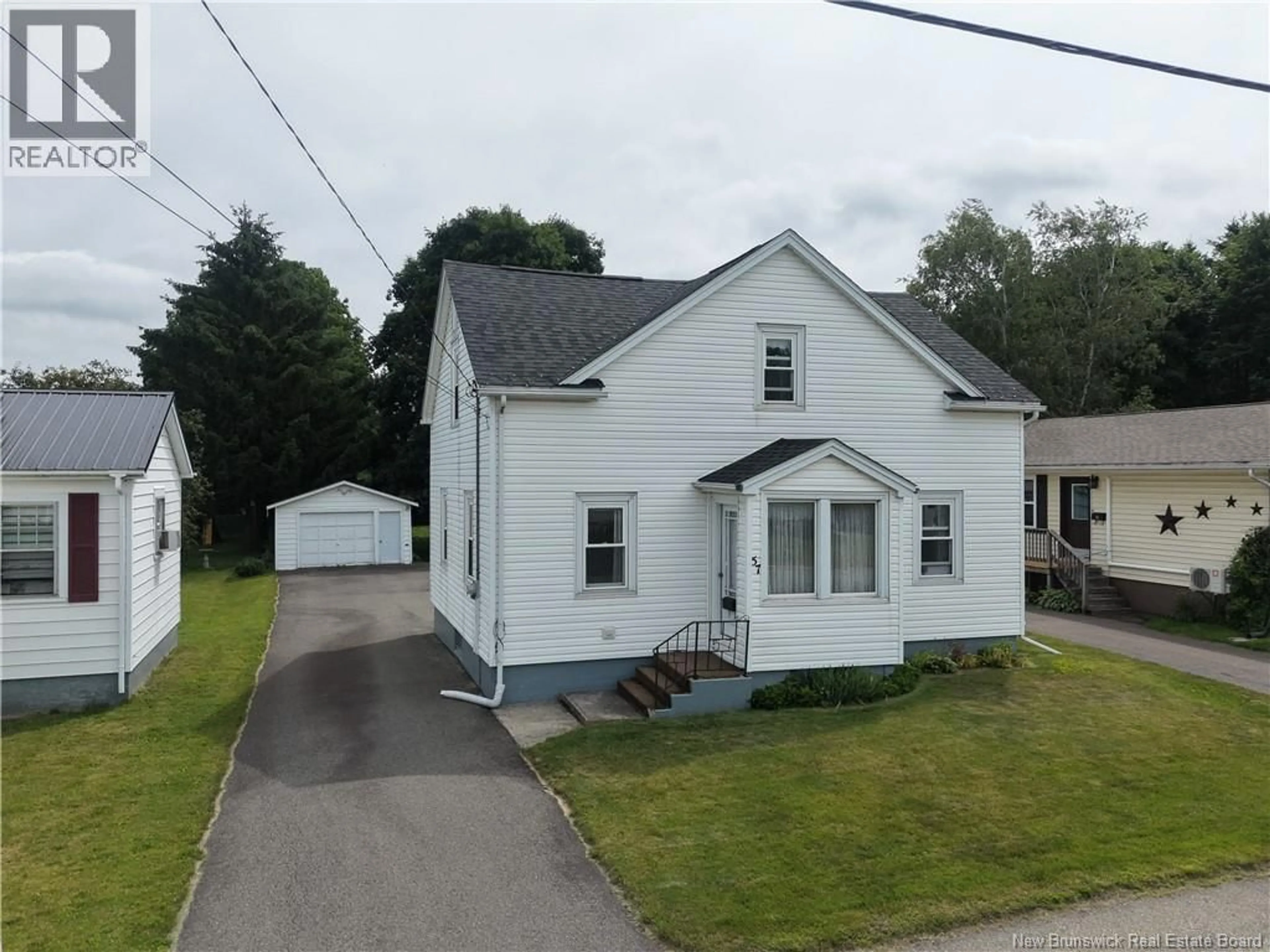 A pic from outside/outdoor area/front of a property/back of a property/a pic from drone, street for 57 CEDAR AVENUE, Sussex New Brunswick E4E1K6