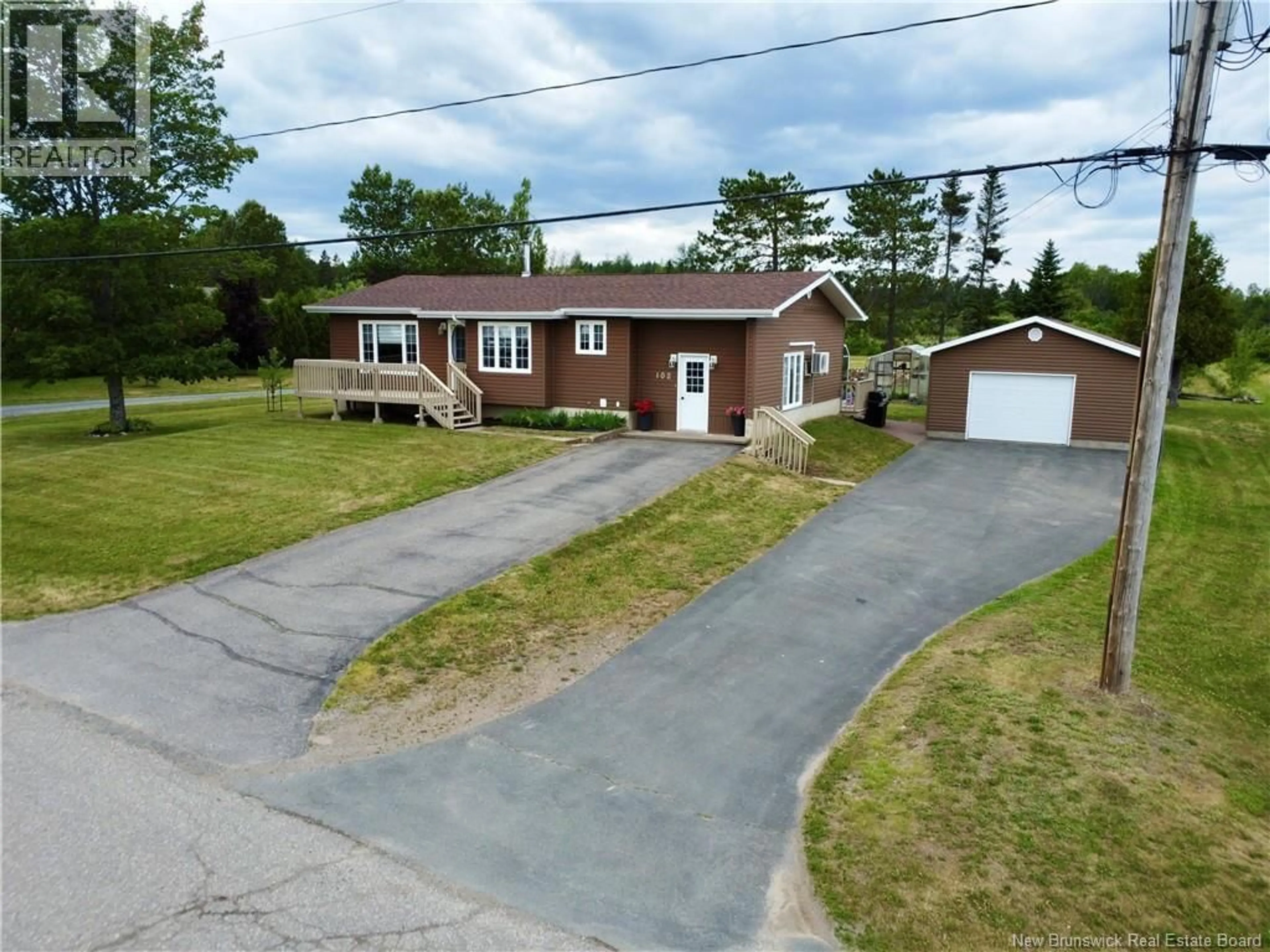 A pic from outside/outdoor area/front of a property/back of a property/a pic from drone, street for 102 NORMANDIE O, Petit-Rocher New Brunswick E8J1P3