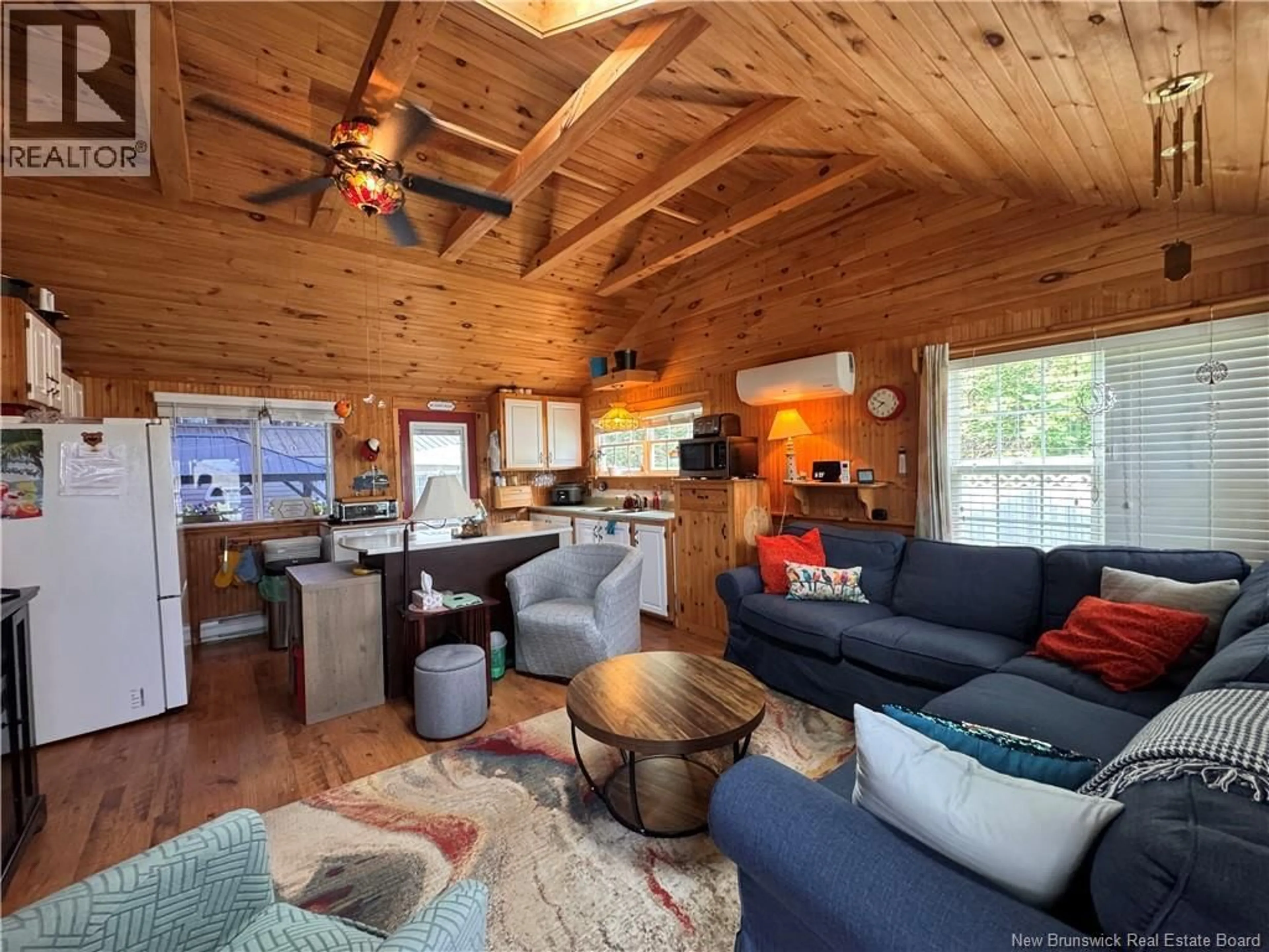 Living room with furniture, wood/laminate floor for 114 IRWIN'S POINT ROAD, Baie Verte New Brunswick E4M1H4