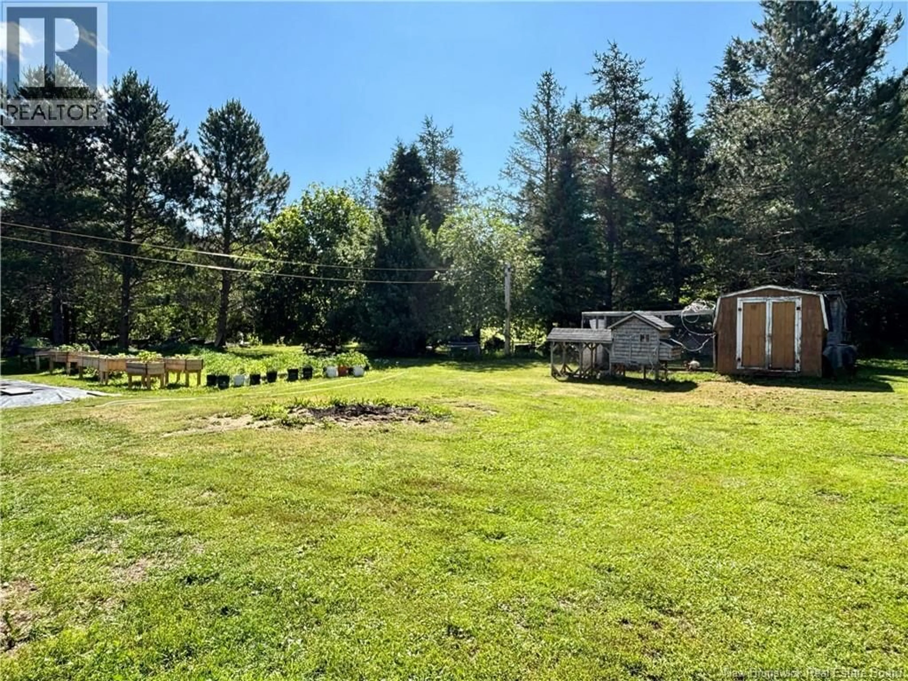 A pic from outside/outdoor area/front of a property/back of a property/a pic from drone, forest/trees view for 23 MOISE LANE, Caissie Road New Brunswick E9G3A1