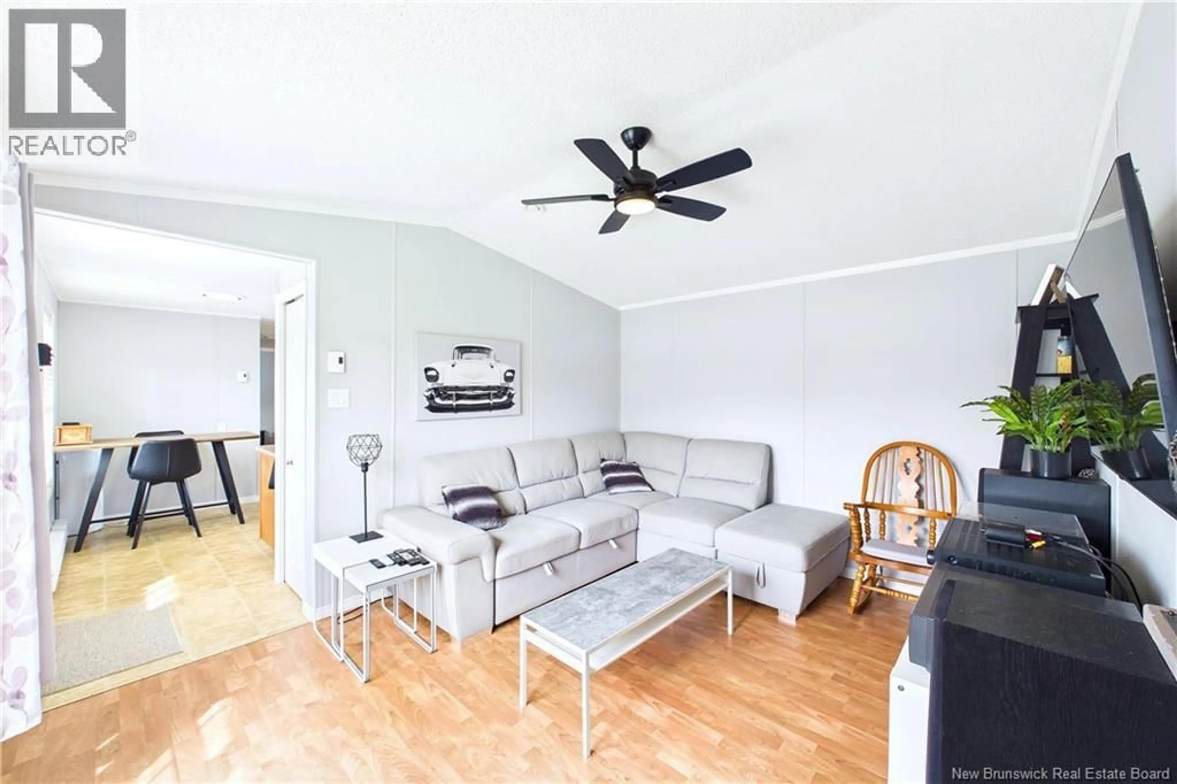 Living room with furniture, wood/laminate floor for 40 DUPUIS, Lakeville New Brunswick E1H1E2