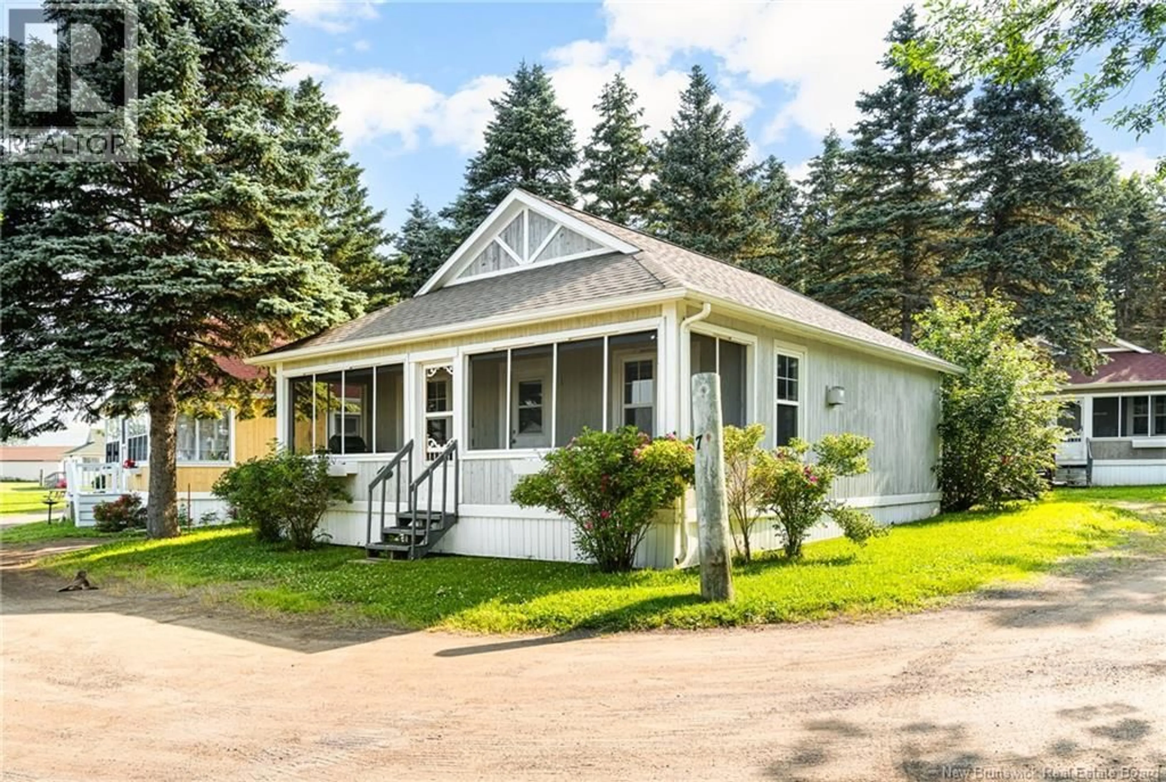 Home with vinyl exterior material, street for 7 - 23 ACADIE, Bouctouche New Brunswick E4S0G3
