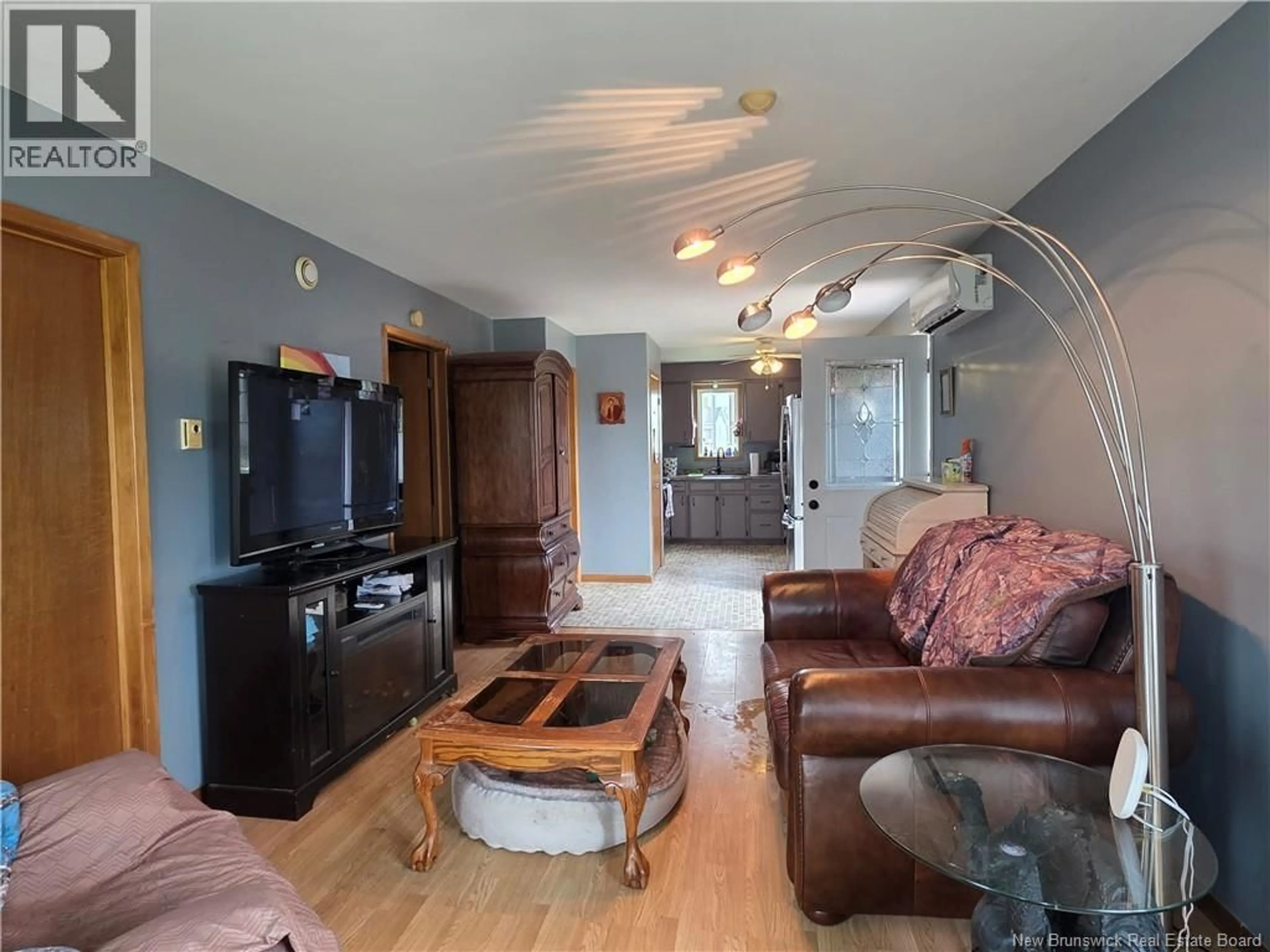 Living room with furniture, wood/laminate floor for 13 ROY STREET, Saint-Antoine New Brunswick E4V1H6