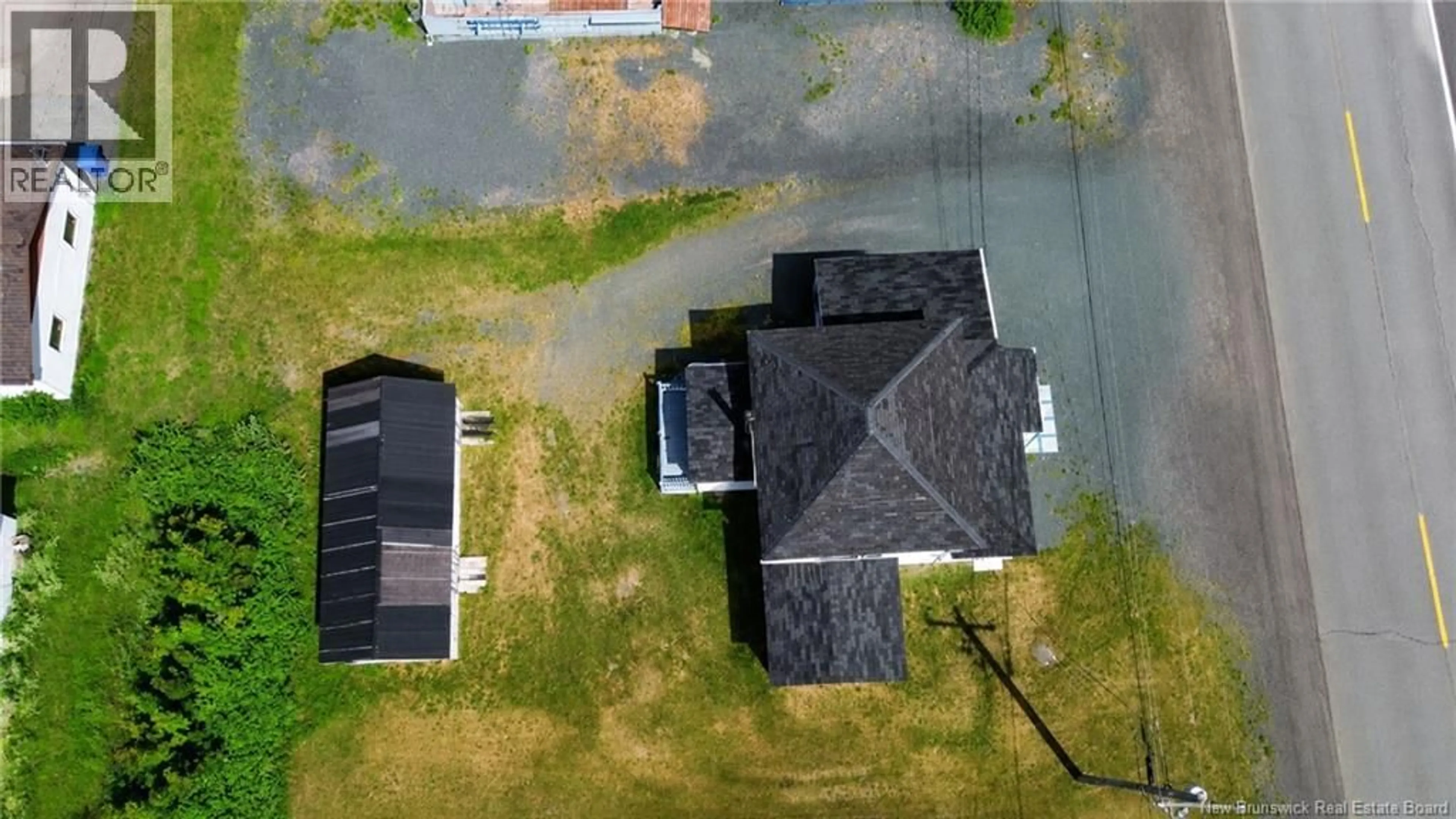 A pic from outside/outdoor area/front of a property/back of a property/a pic from drone, unknown for 102 RUE DE LA GARE, Pointe-Verte New Brunswick E8J2Z1