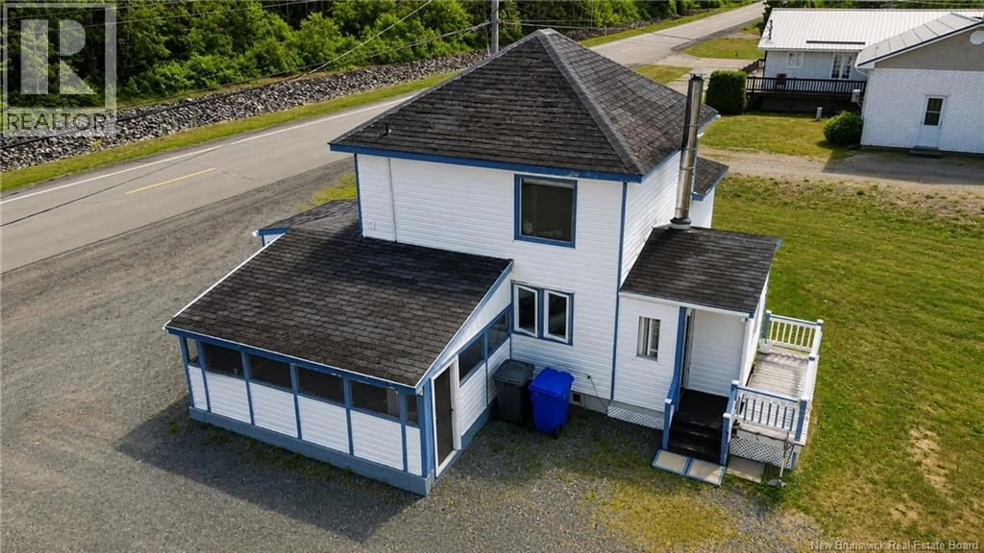 A pic from outside/outdoor area/front of a property/back of a property/a pic from drone, building for 102 RUE DE LA GARE, Pointe-Verte New Brunswick E8J2Z1