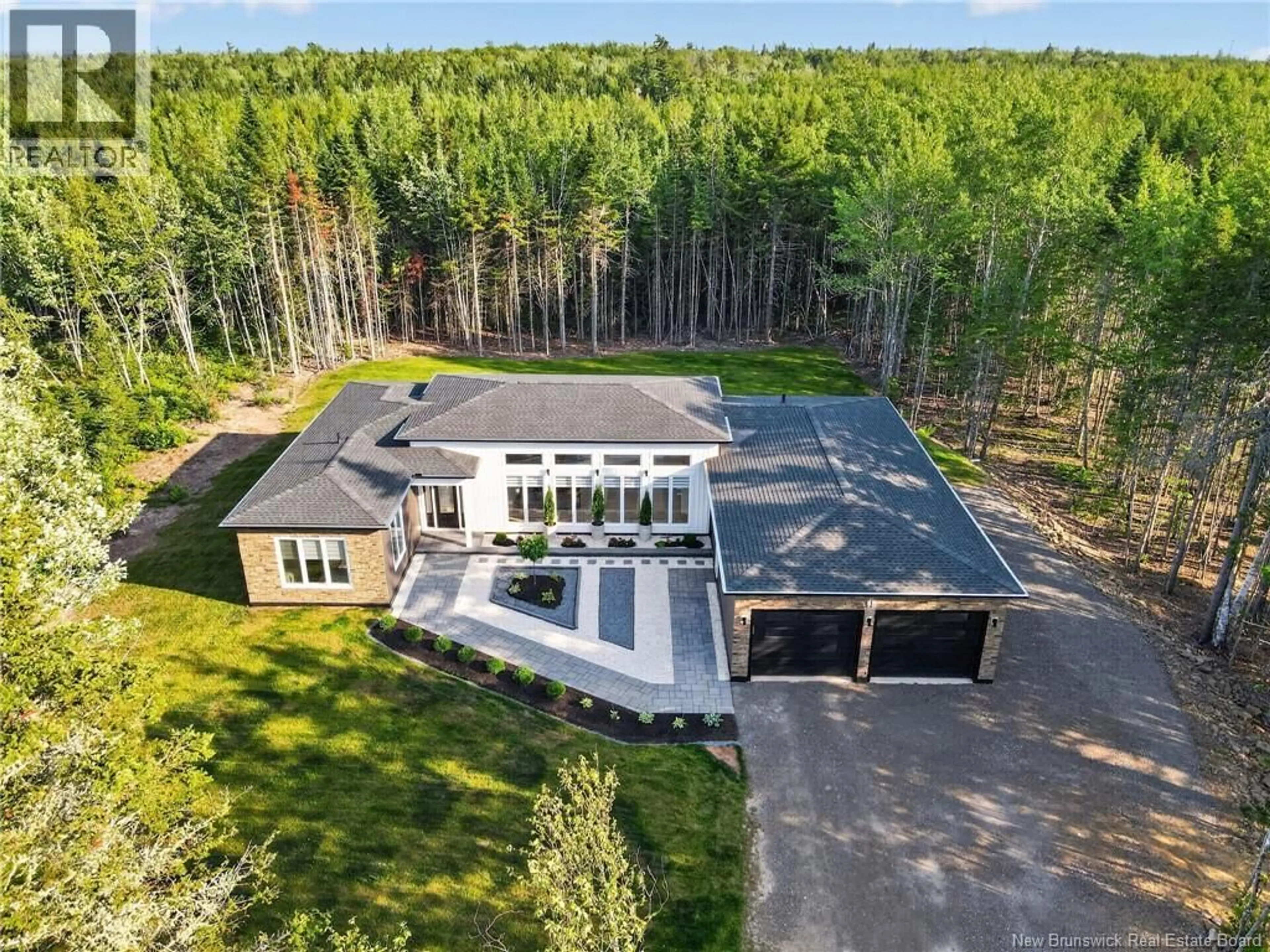 A pic from outside/outdoor area/front of a property/back of a property/a pic from drone, forest/trees view for 95 VIA ROMA WAY, Irishtown New Brunswick E1H0H9