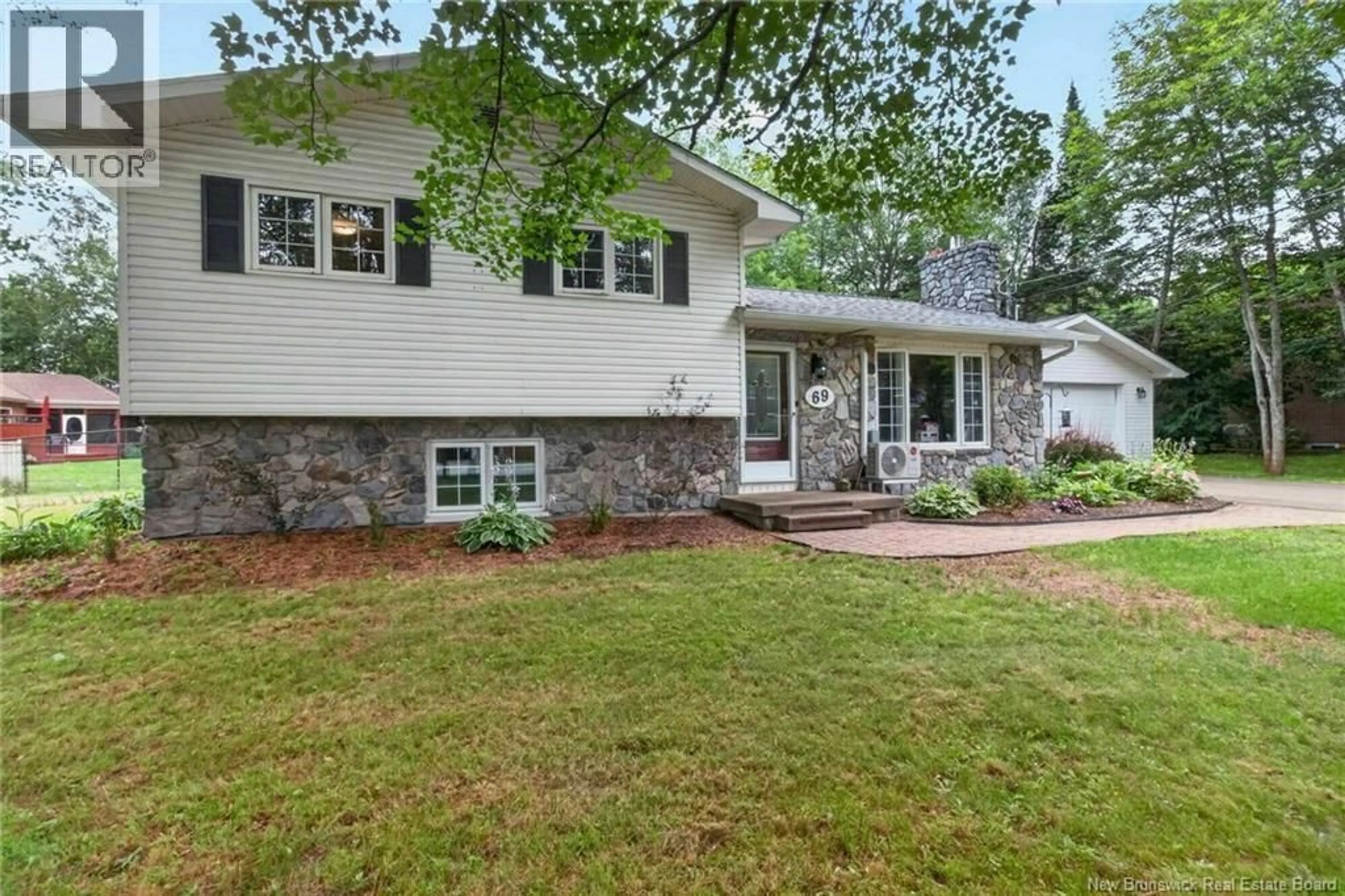 Home with vinyl exterior material, street for 69 THOMAS STREET, Dieppe New Brunswick E1A2C4