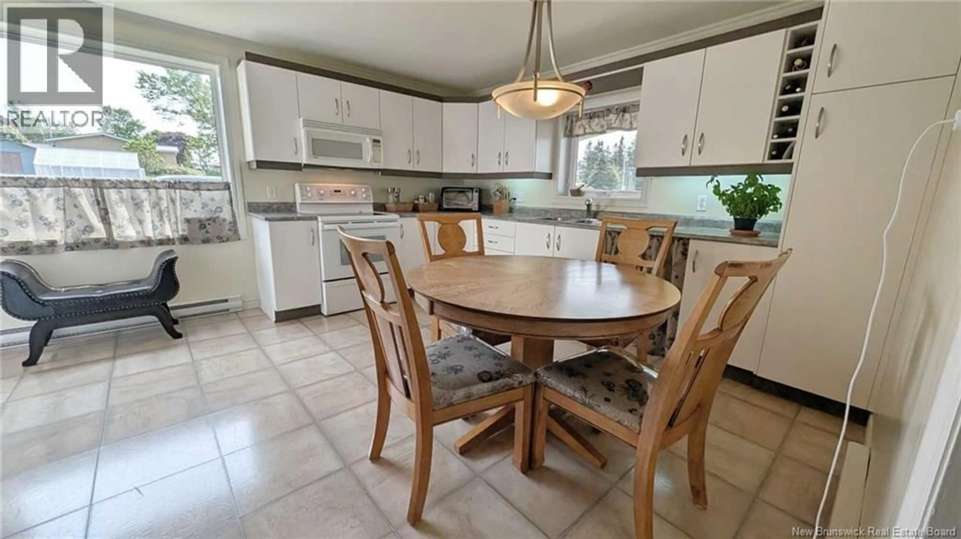 Open concept kitchen, ceramic/tile floor for 15 RUE DU PORTAGE, Caraquet New Brunswick E1W1B2