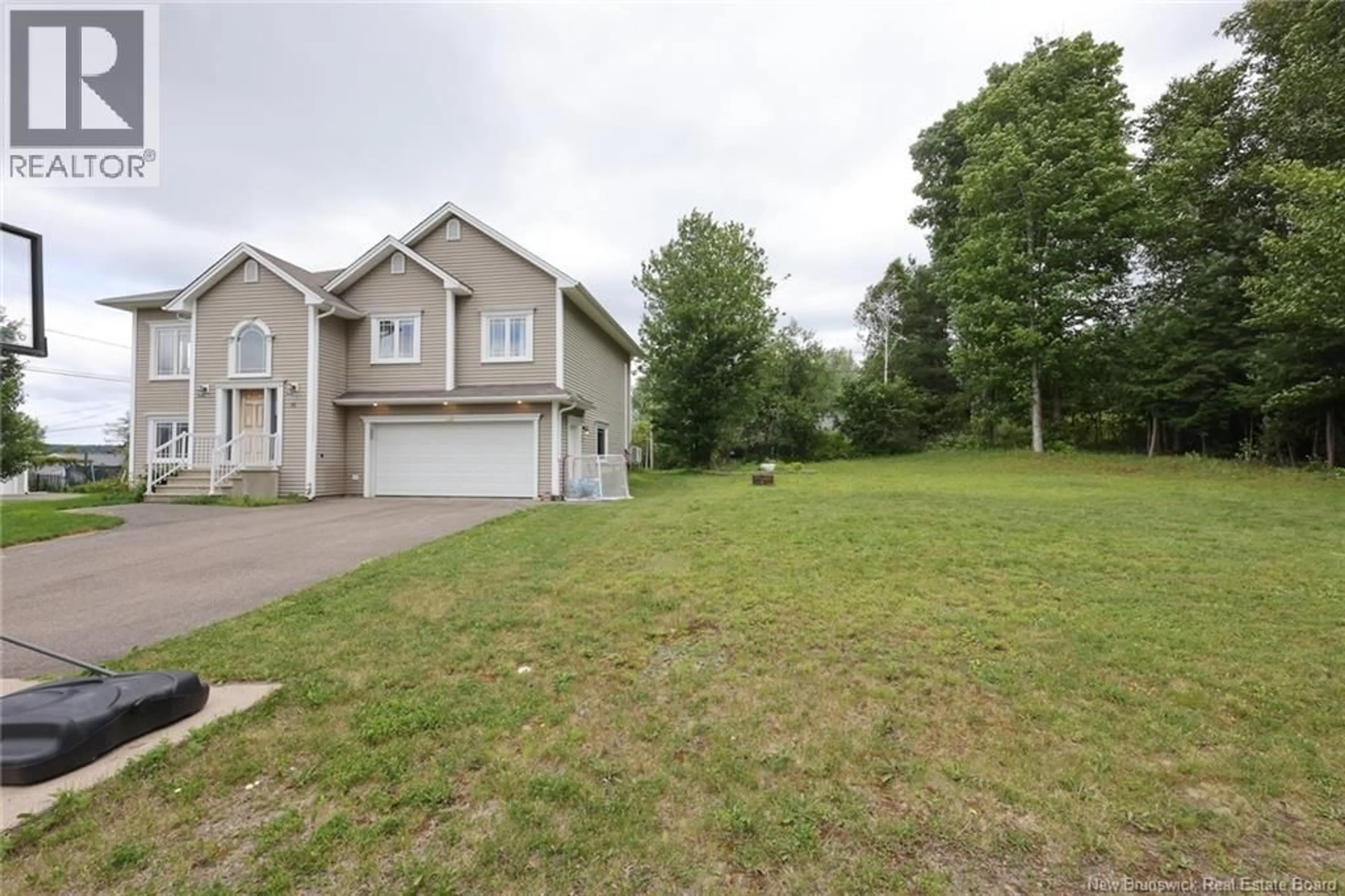 A pic from outside/outdoor area/front of a property/back of a property/a pic from drone, street for 75 WHISPERWOOD DRIVE, Fredericton New Brunswick E3C0J8