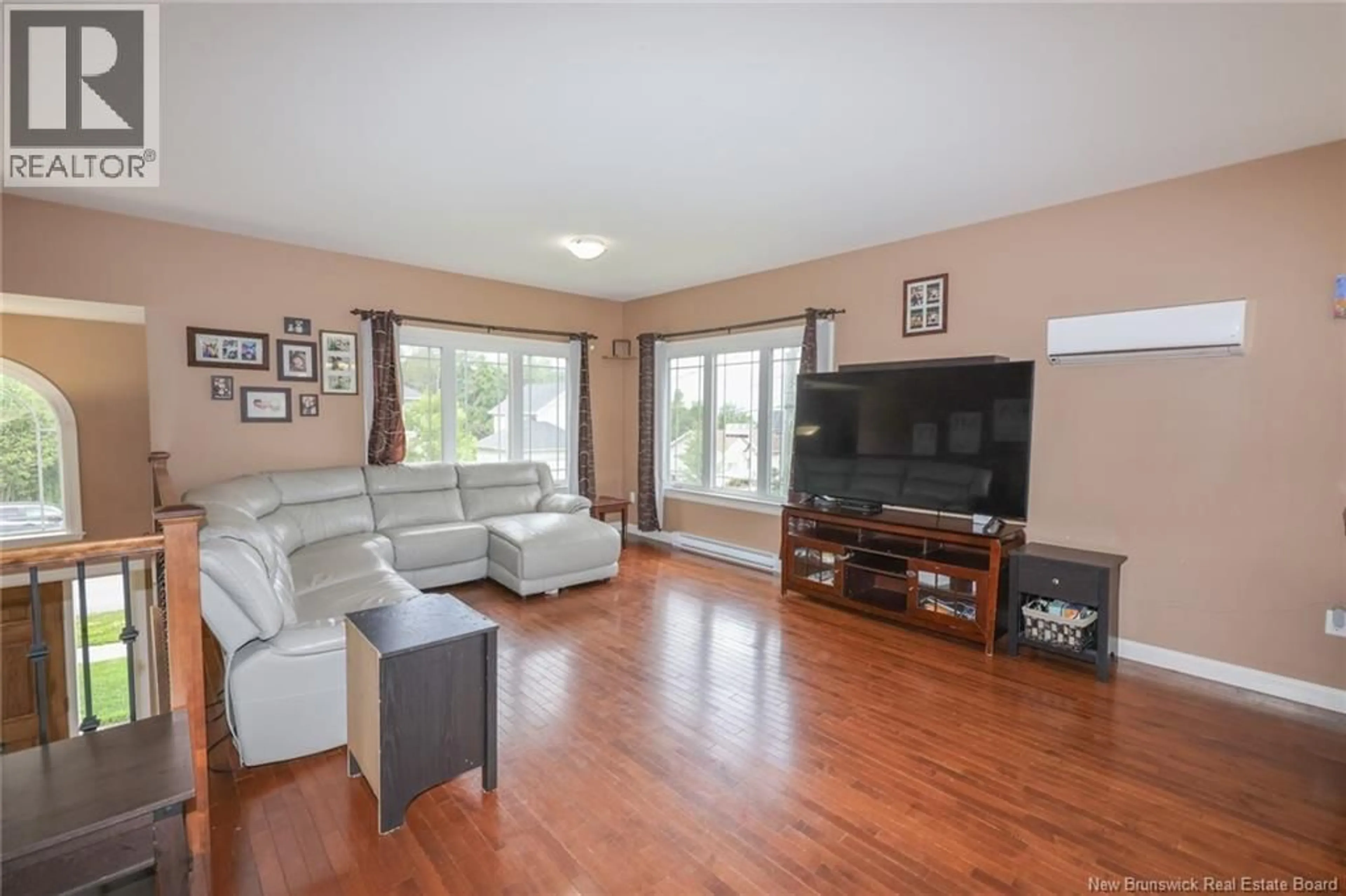 Living room with furniture, wood/laminate floor for 75 WHISPERWOOD DRIVE, Fredericton New Brunswick E3C0J8