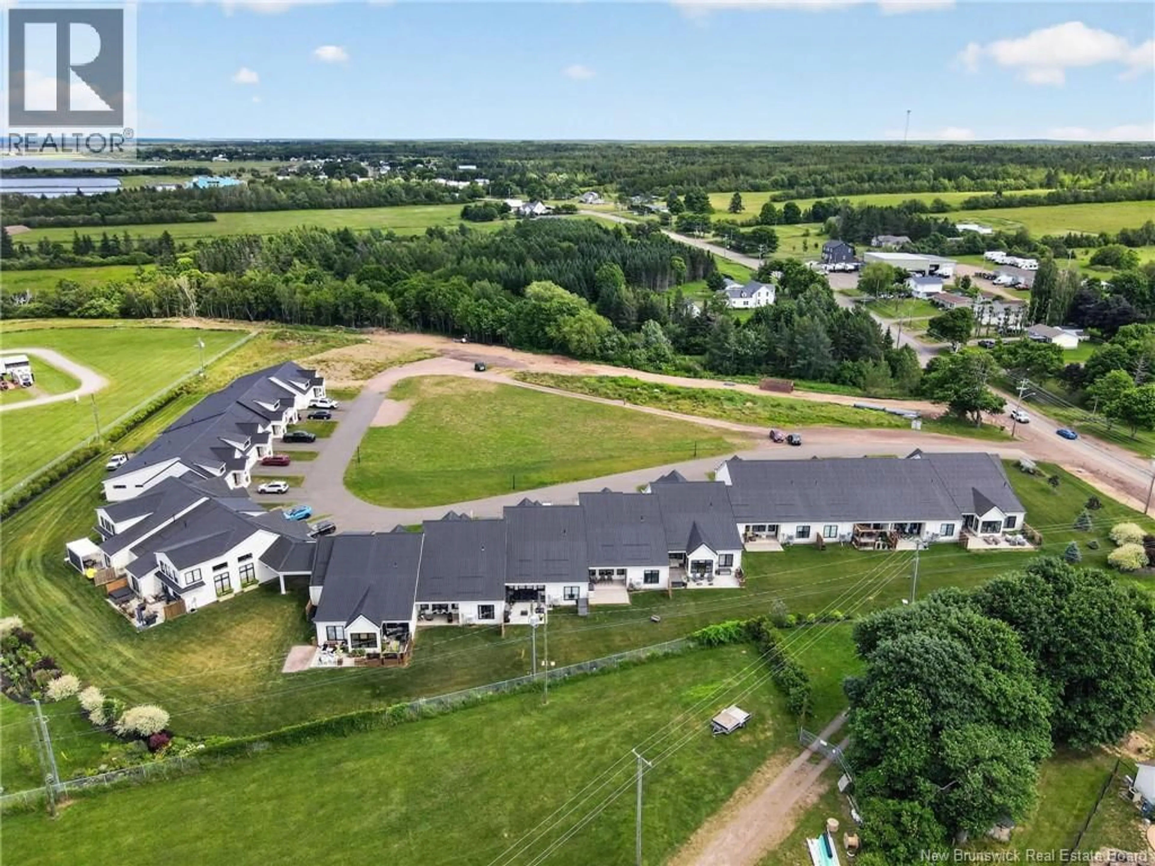 A pic from outside/outdoor area/front of a property/back of a property/a pic from drone, unknown for 106 - 724 ROUTE 133 ROAD, Pointe-Du-Chêne New Brunswick E4P5A3