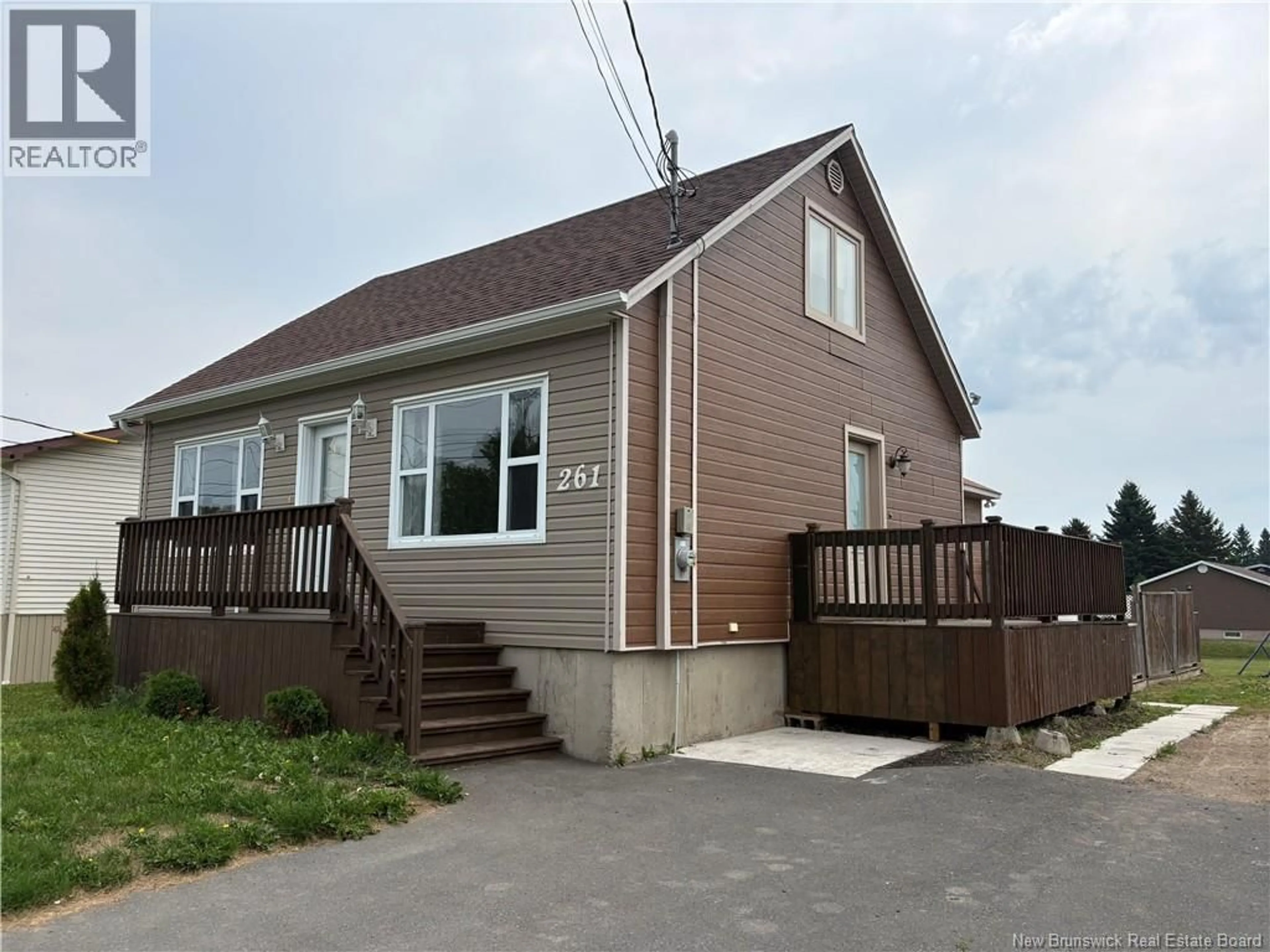 Home with vinyl exterior material, street for 261 MARIE STREET, Beresford New Brunswick E8K1P9