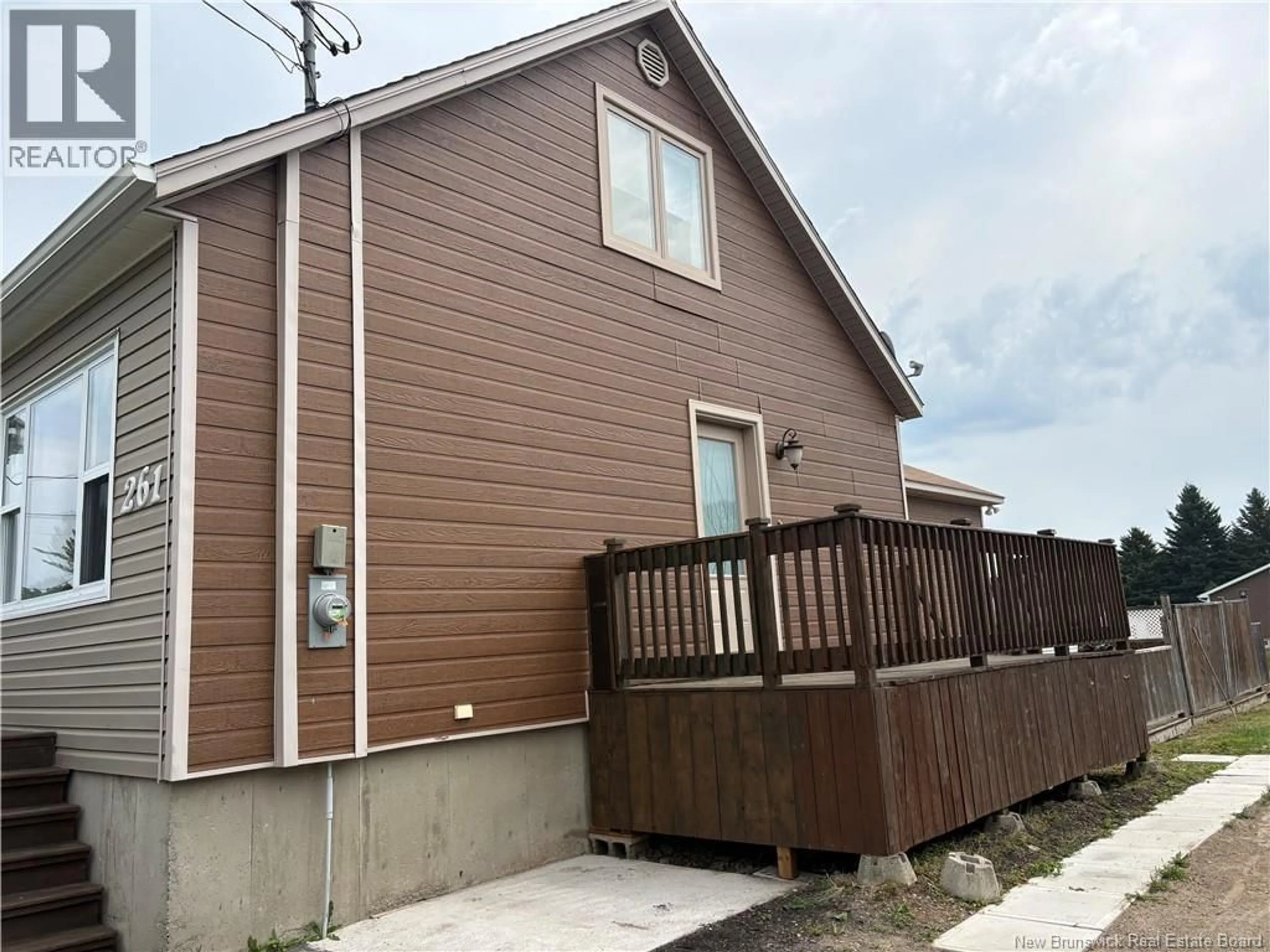 Home with vinyl exterior material, street for 261 MARIE STREET, Beresford New Brunswick E8K1P9