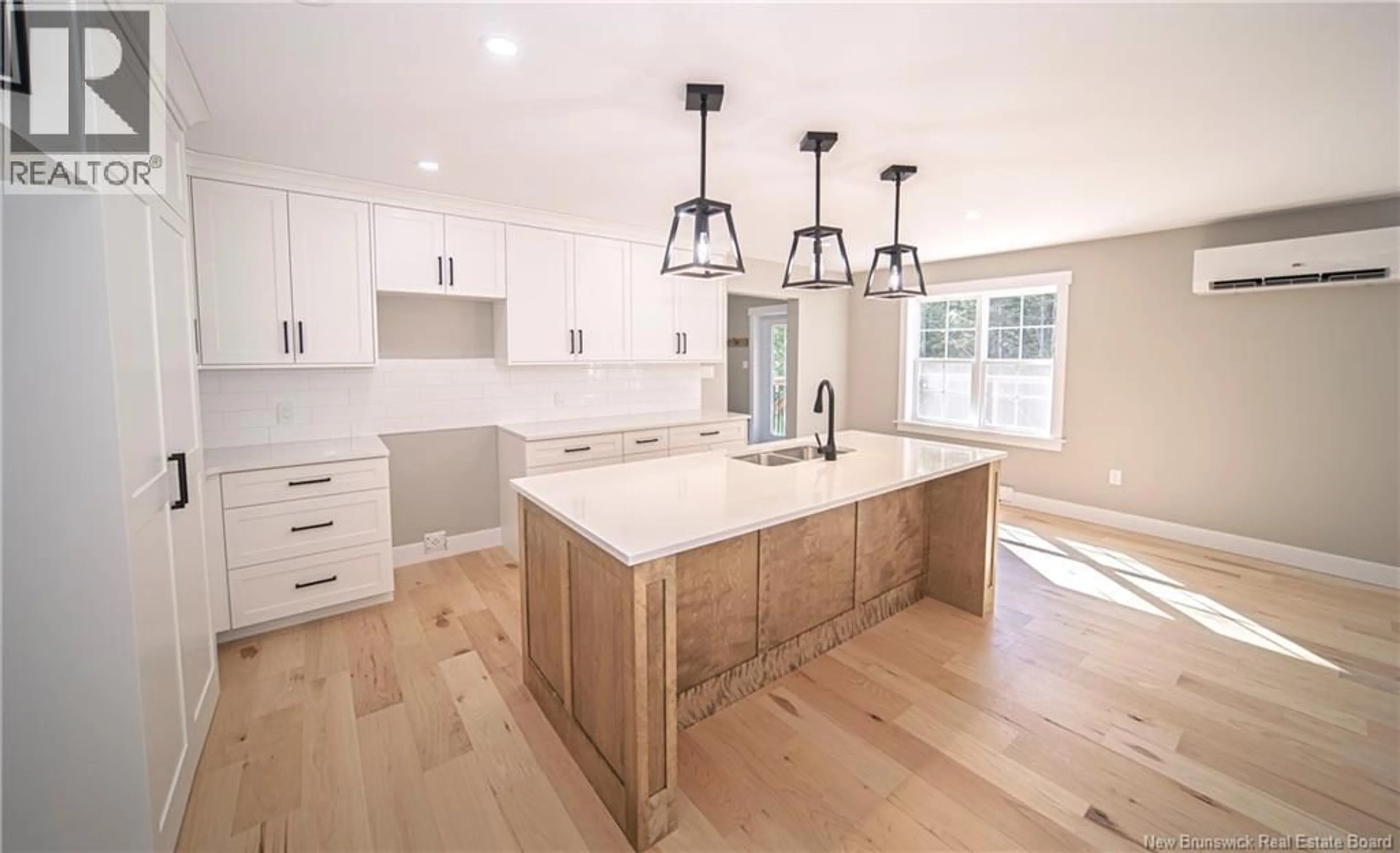 Open concept kitchen, wood/laminate floor for 39 LAURA LANE, Charters Settlement New Brunswick E3C0R4