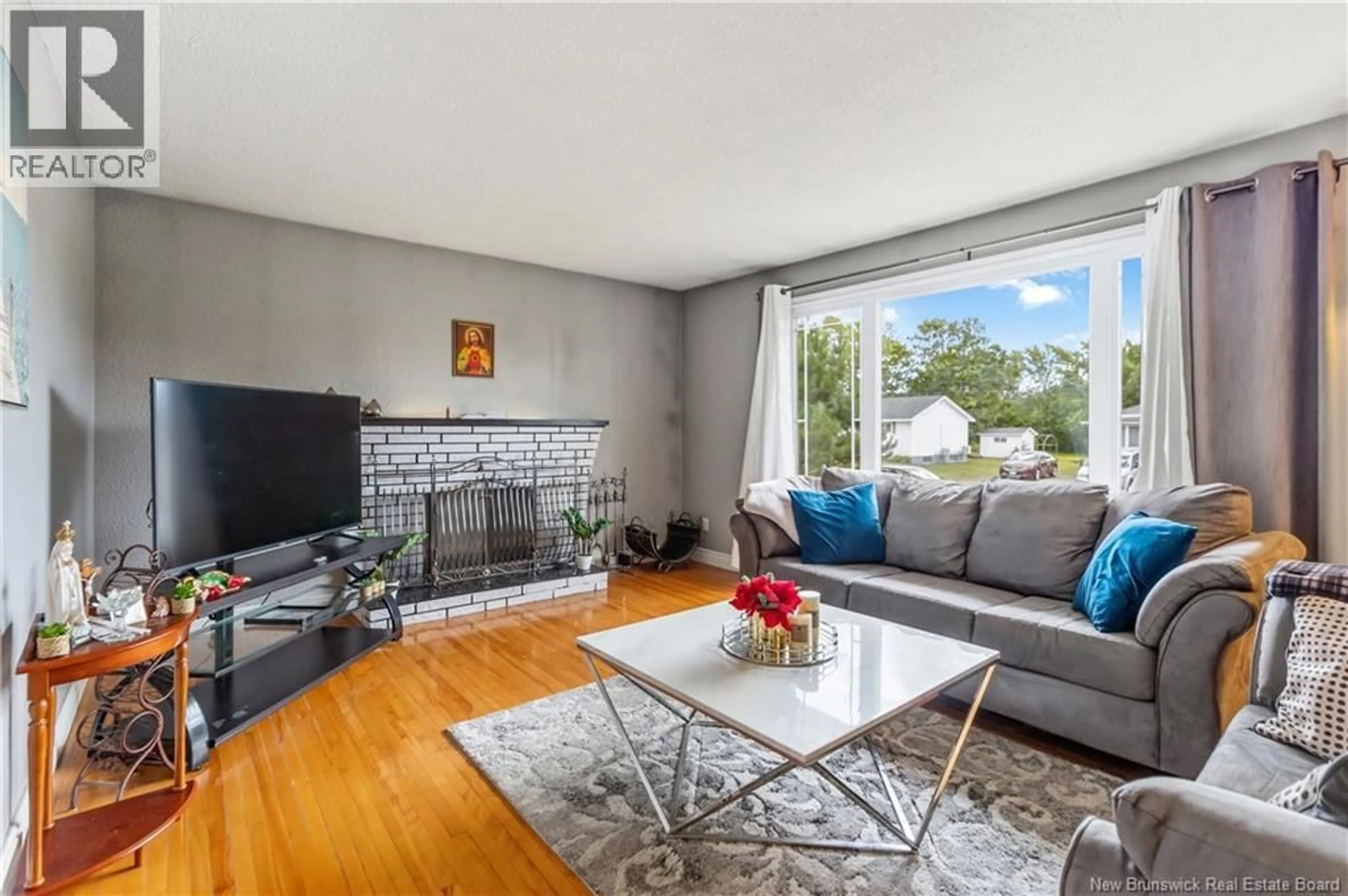 Living room with furniture, wood/laminate floor for 236 CHAPELLE STREET, Dieppe New Brunswick E1A1B2