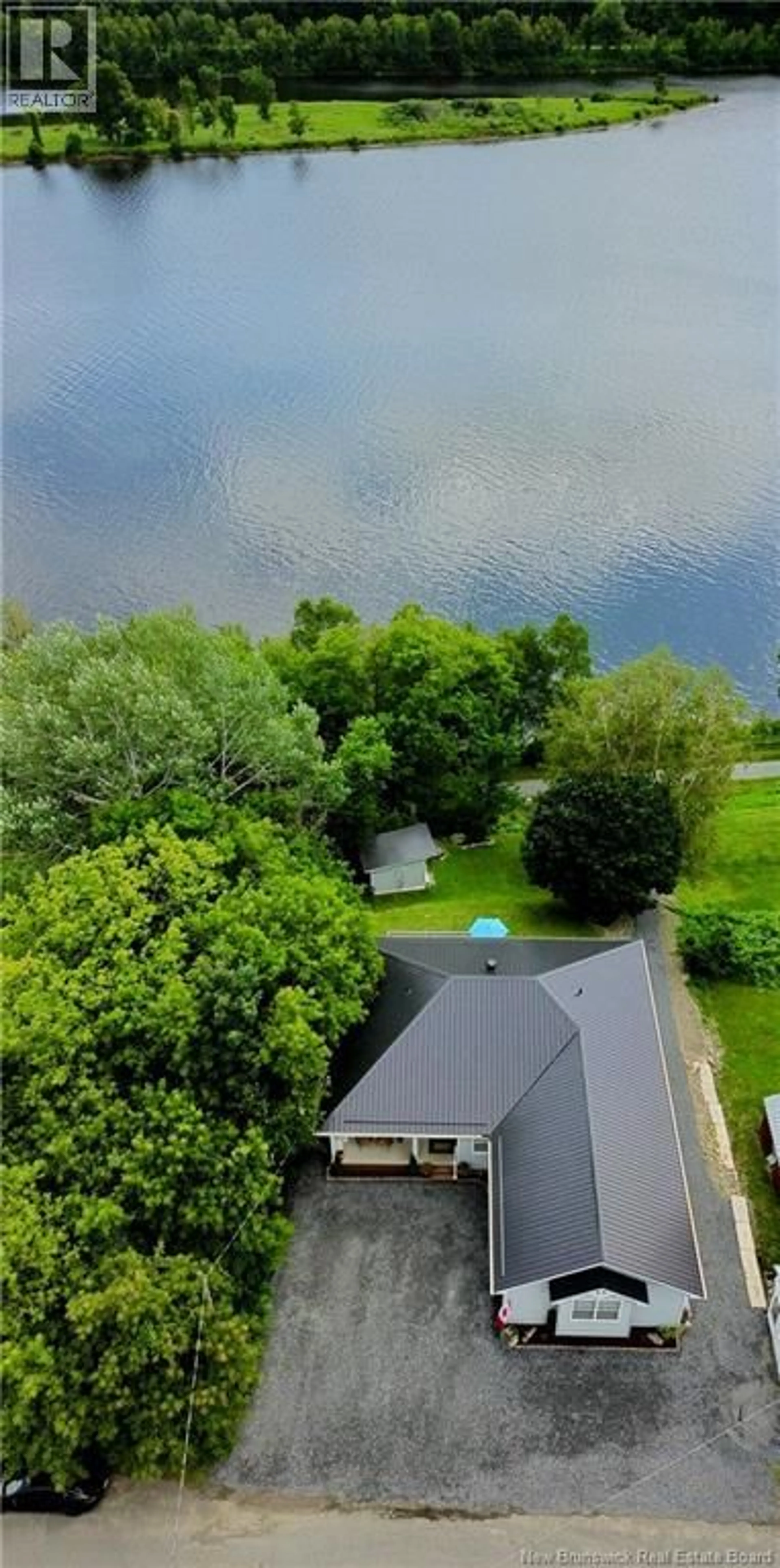 A pic from outside/outdoor area/front of a property/back of a property/a pic from drone, water/lake/river/ocean view for 136 RICHMOND STREET, Woodstock New Brunswick E7M2P2