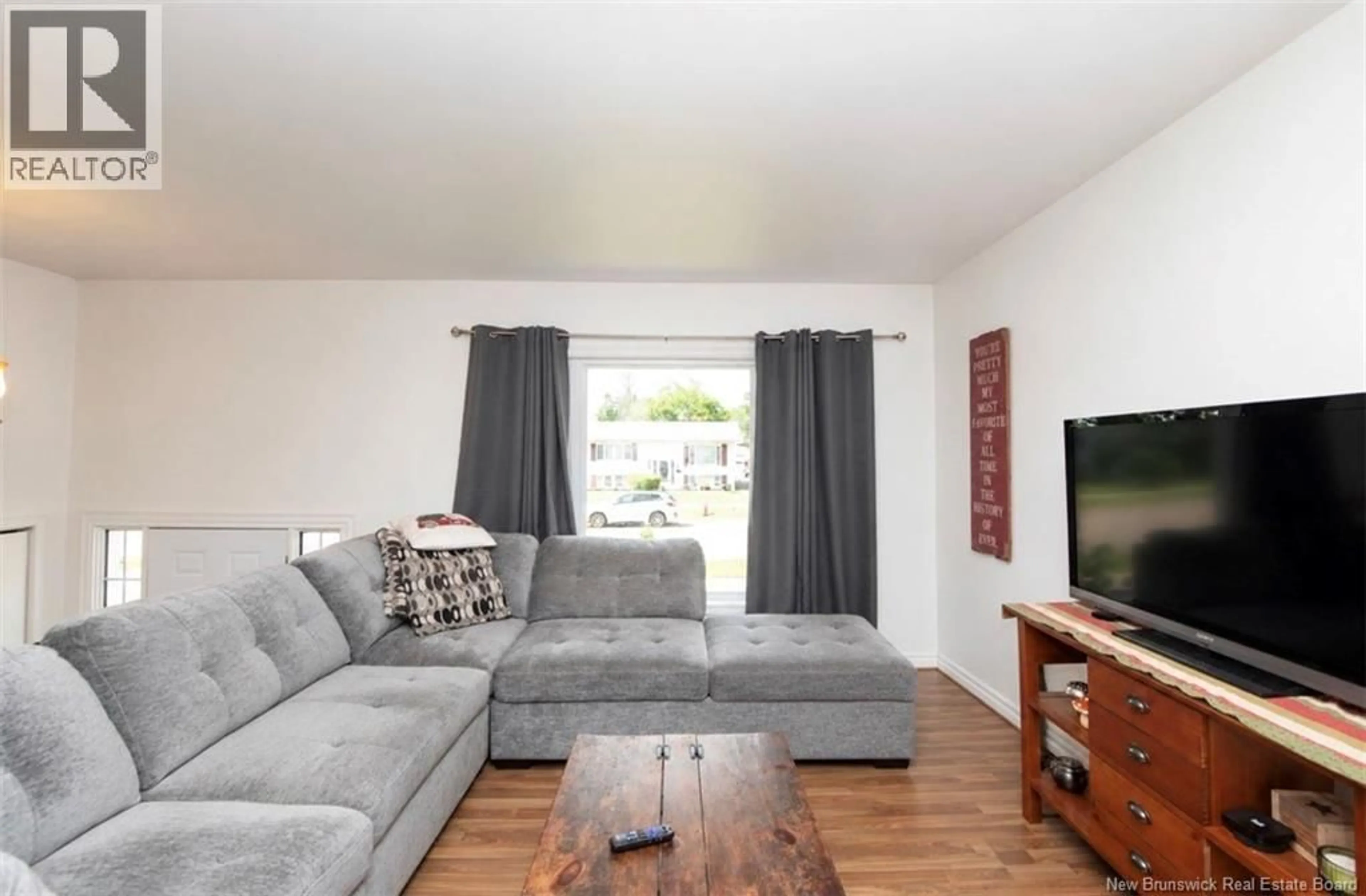 Living room with furniture, wood/laminate floor for 64 PASADENA DRIVE, Moncton New Brunswick E1G1H5
