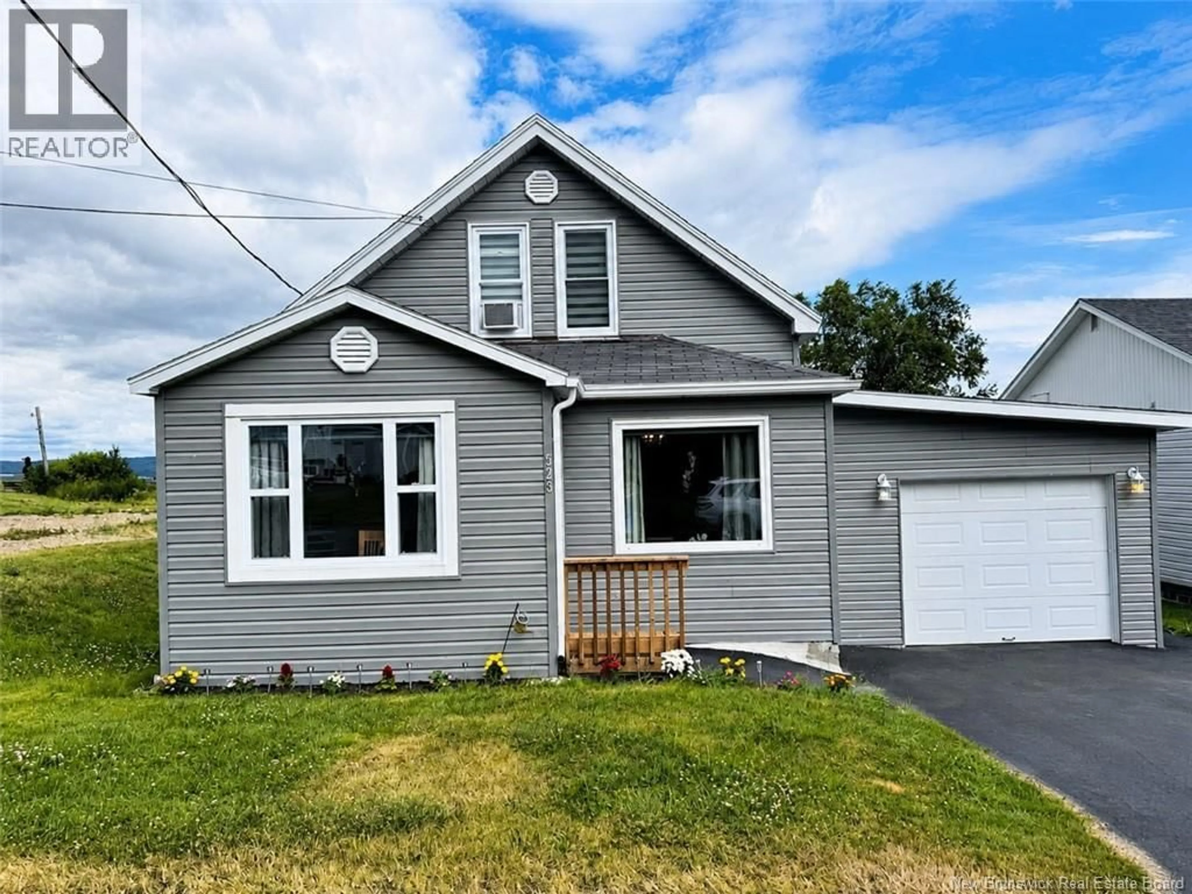 Home with vinyl exterior material, street for 523 QUEEN STREET, Dalhousie New Brunswick E8C2G7