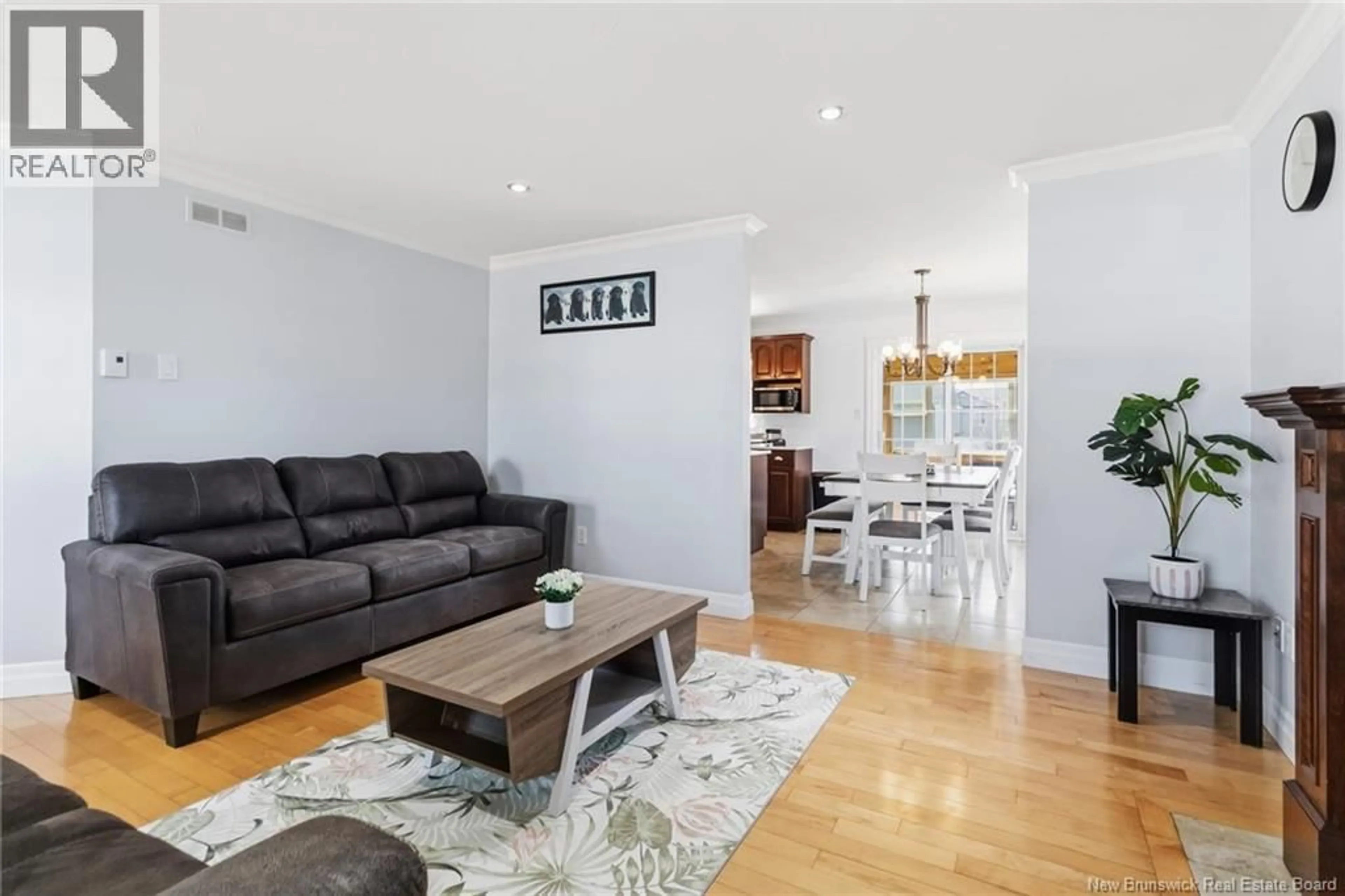 Living room with furniture, wood/laminate floor for 385 MANDEVILLE STREET, Dieppe New Brunswick E1A6V6