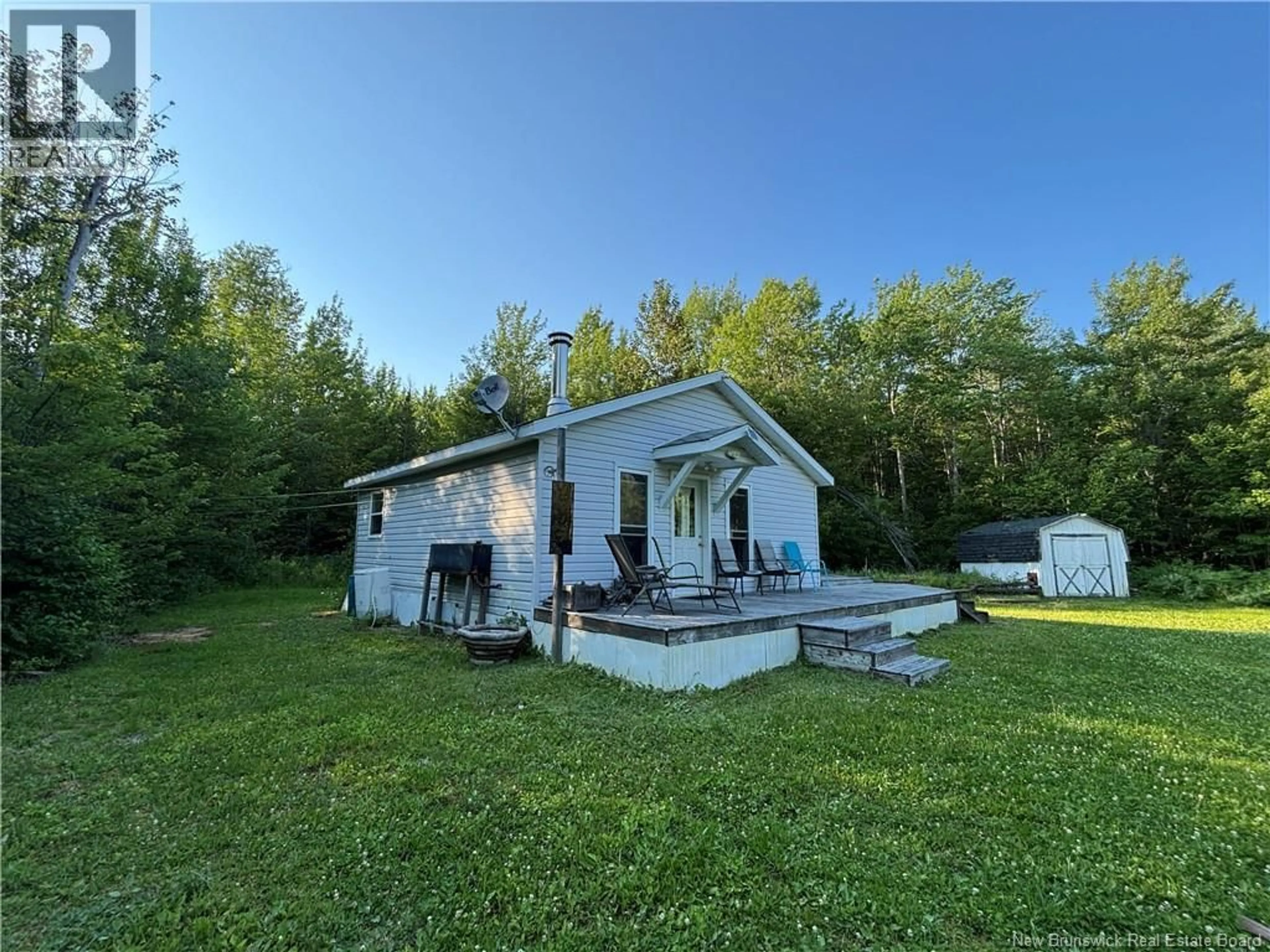 A pic from outside/outdoor area/front of a property/back of a property/a pic from drone, water/lake/river/ocean view for 848 C+B RUE PRINCIPALE, Beresford New Brunswick E8K2G7