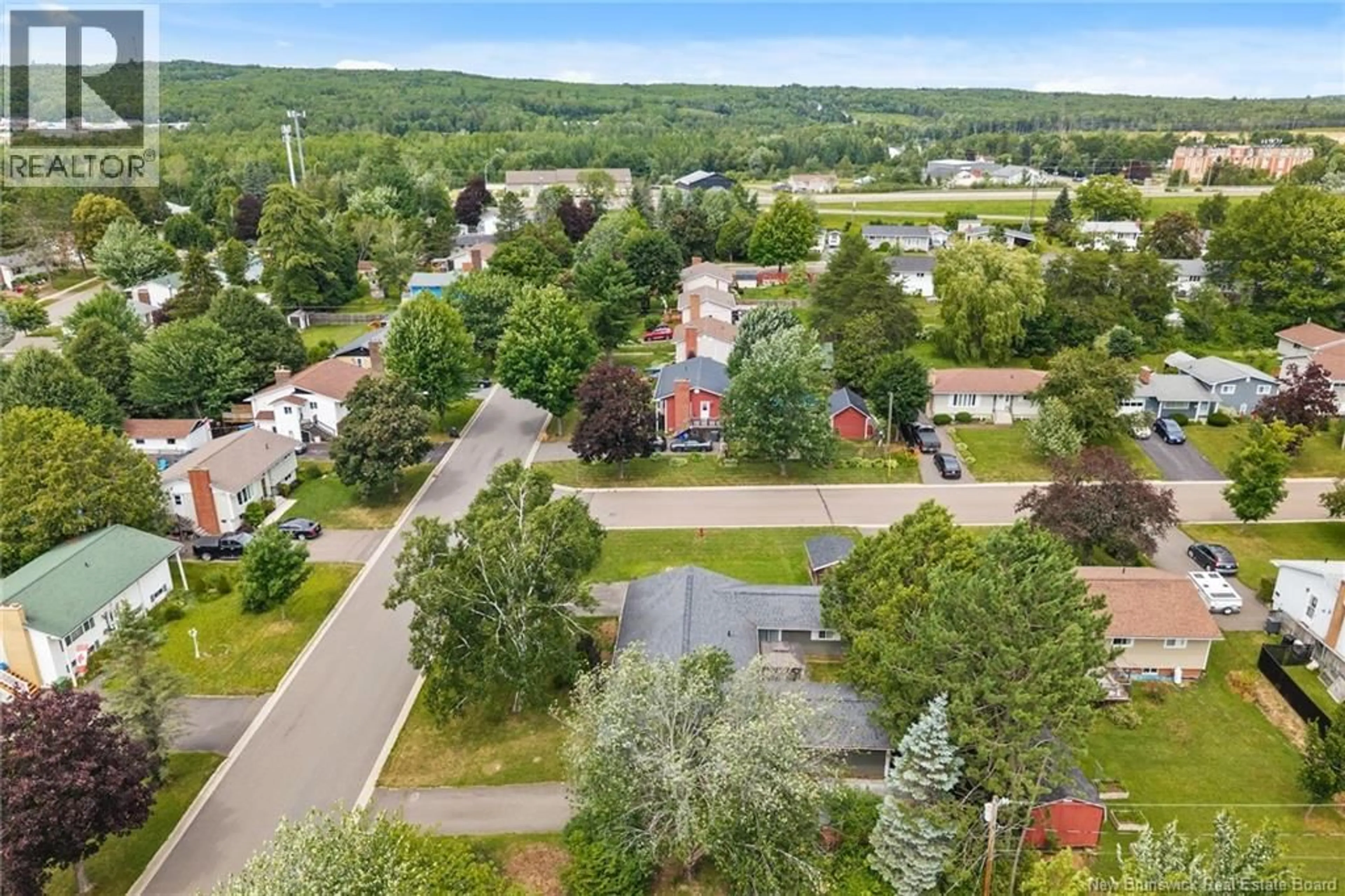 A pic from outside/outdoor area/front of a property/back of a property/a pic from drone, unknown for 52-54 LOMBARDI LANE, Fredericton New Brunswick E3A1N7