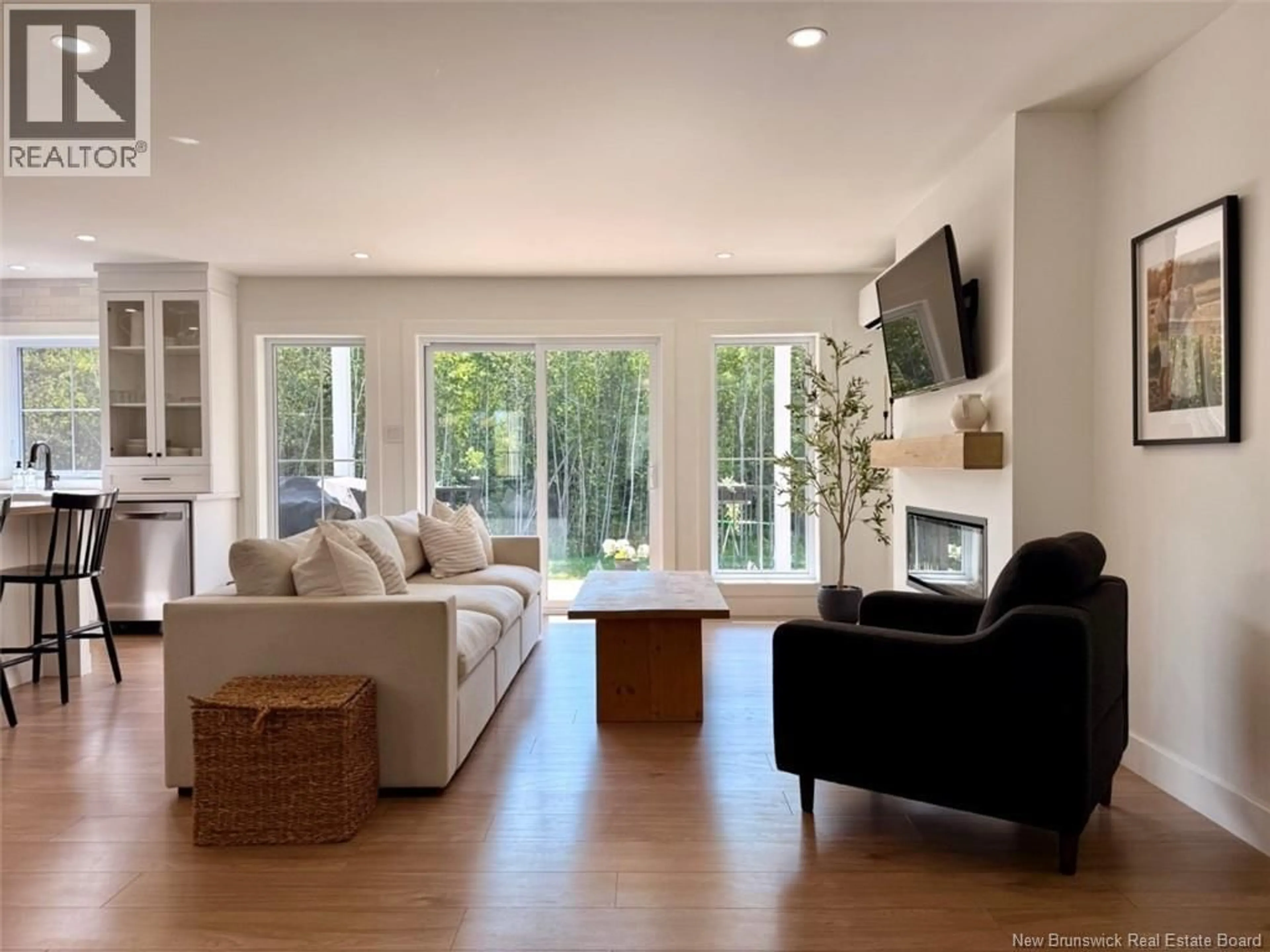 Living room with furniture, wood/laminate floor for 57 THOMPSON ROAD, Charlo New Brunswick E8E2S6