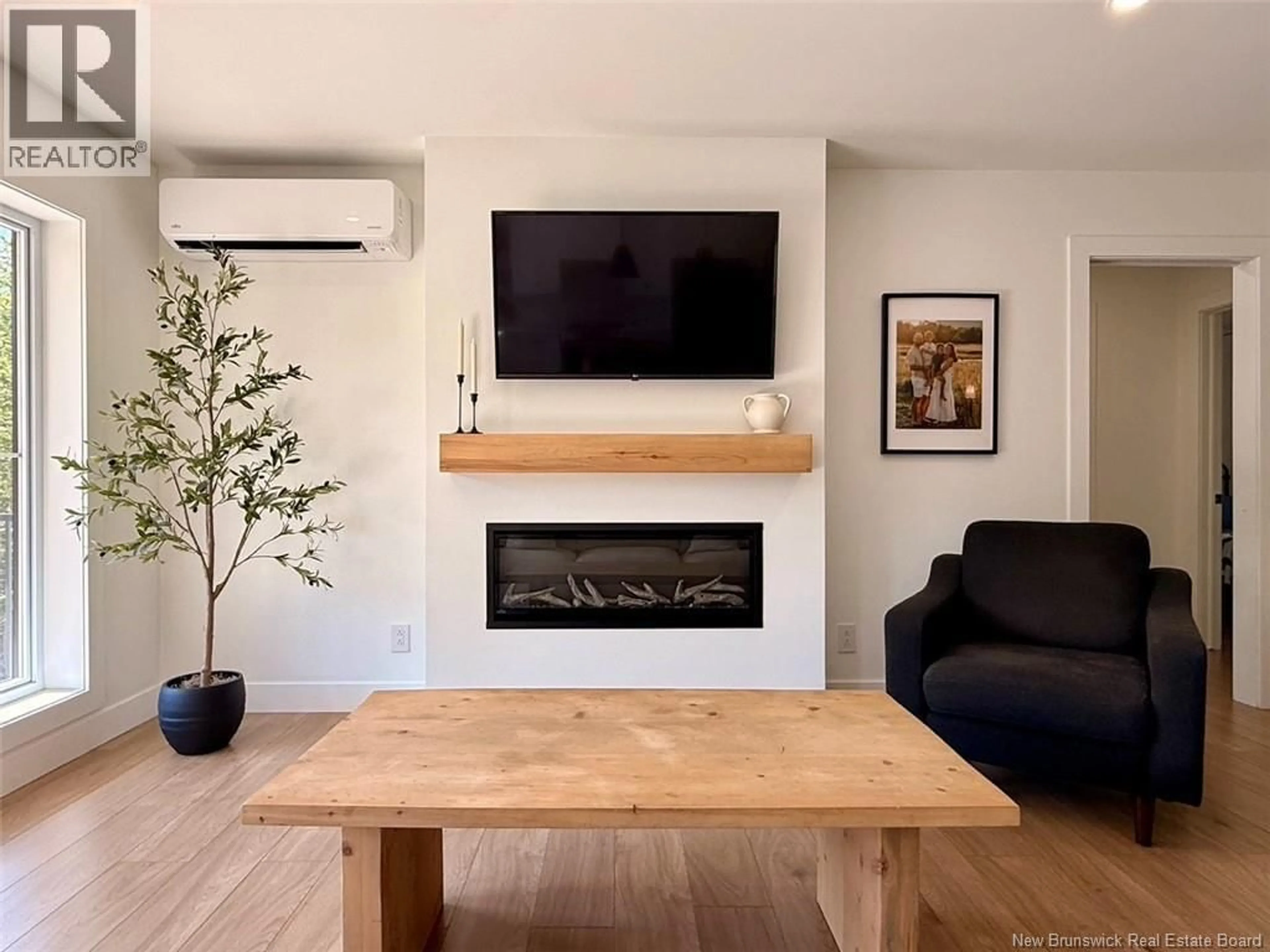 Living room with furniture, wood/laminate floor for 57 THOMPSON ROAD, Charlo New Brunswick E8E2S6