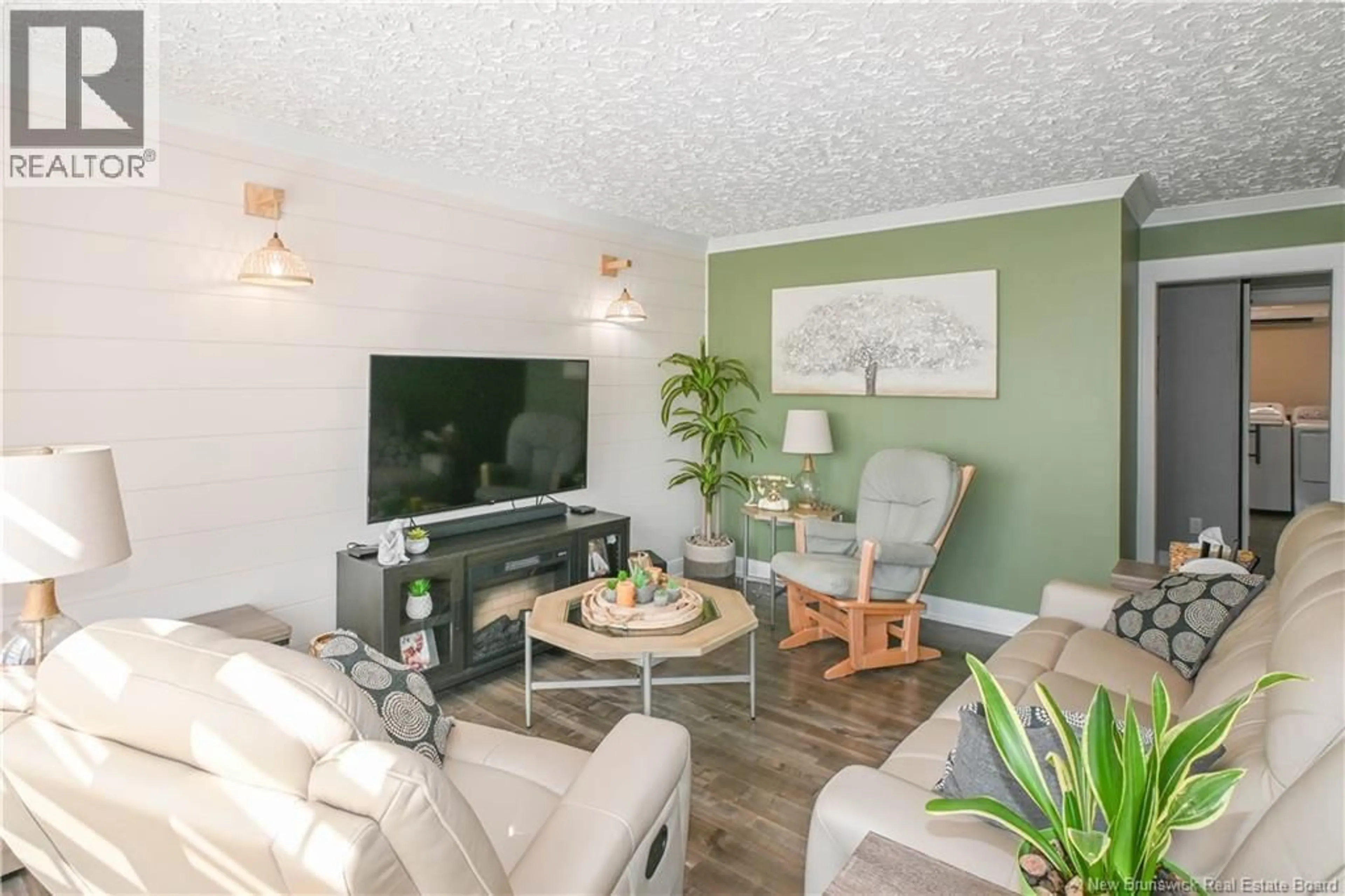 Living room with furniture, wood/laminate floor for 1783 ROUTE 310, Coteau Road New Brunswick E8T3K9