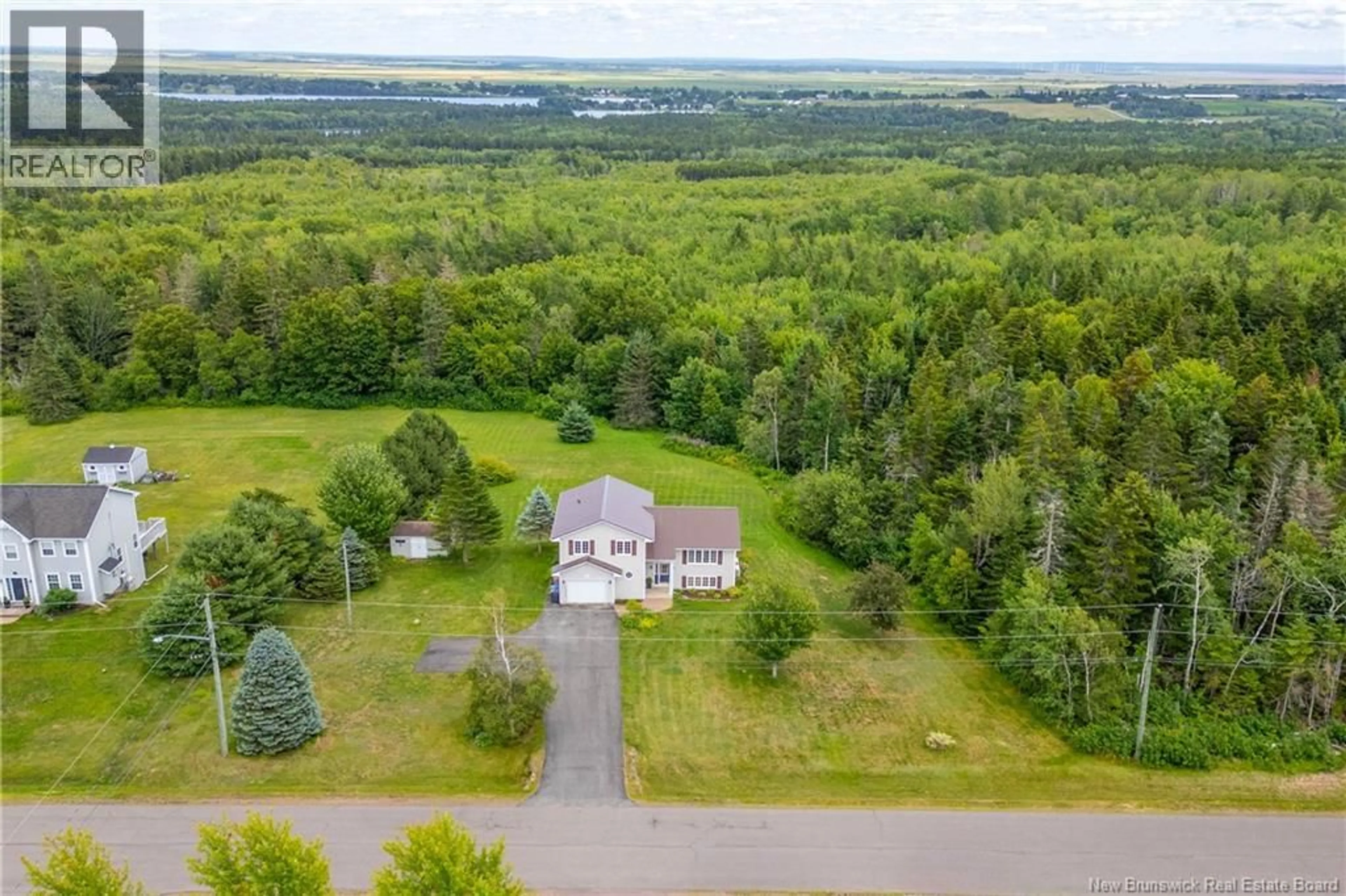 A pic from outside/outdoor area/front of a property/back of a property/a pic from drone, water/lake/river/ocean view for 26 CARRIAGE COURT, Sackville New Brunswick E4L1B2