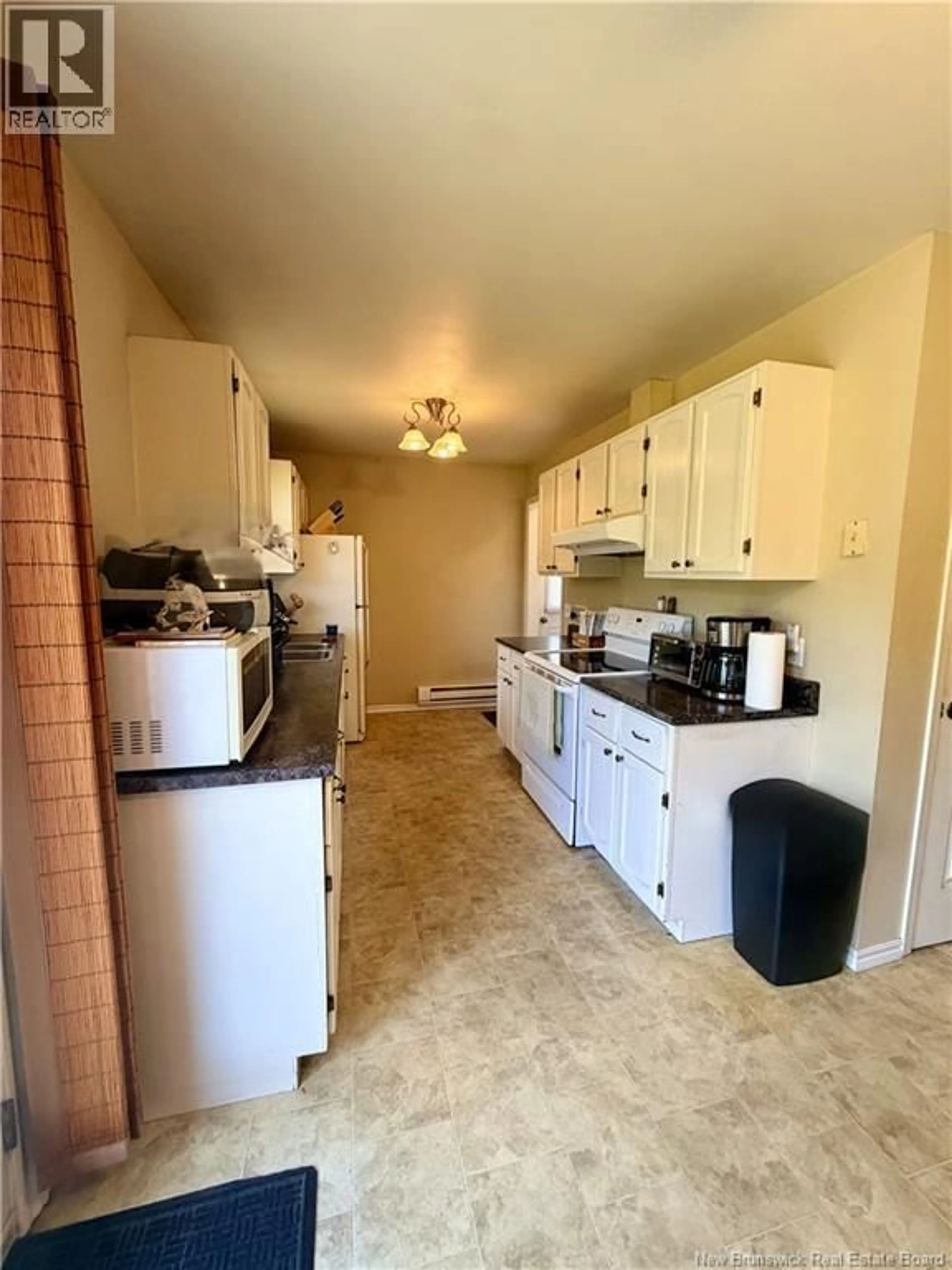 Kitchen with laundary machines, ceramic/tile floor for 377 WILLISTON DRIVE, Miramichi New Brunswick E1V5X5