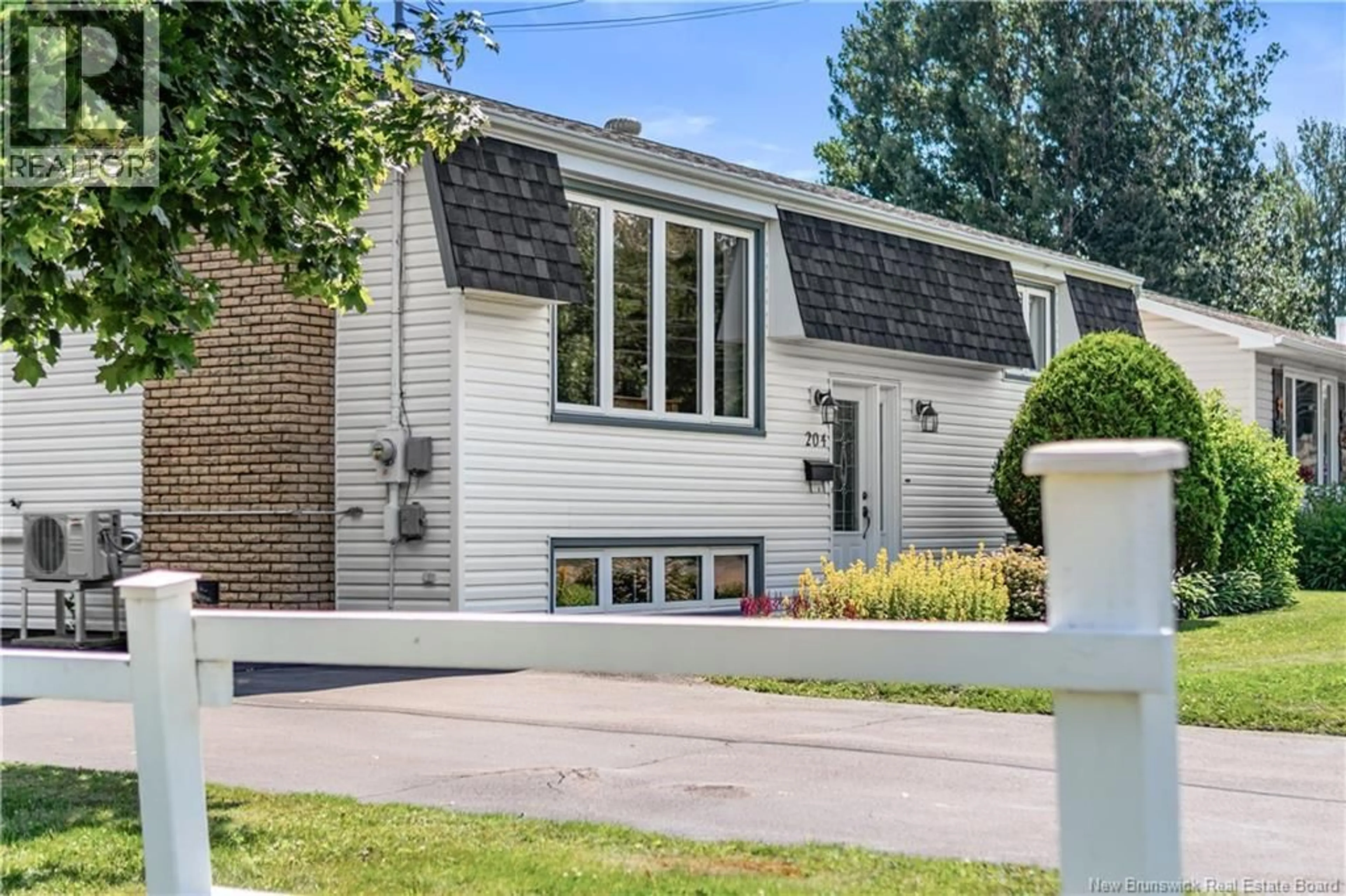 Home with vinyl exterior material, street for 204 THIBODEAU, Dieppe New Brunswick E1A1V5