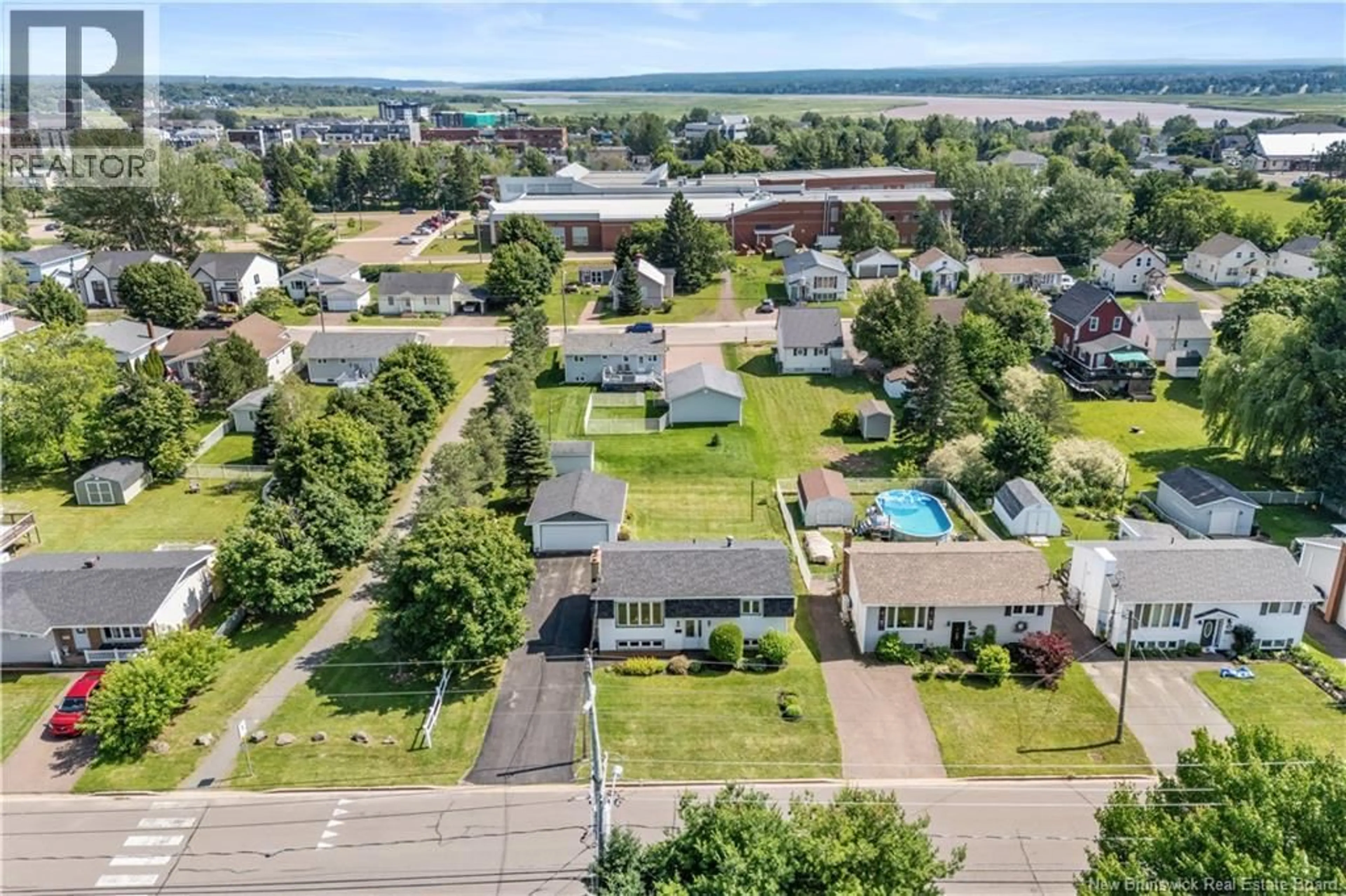 A pic from outside/outdoor area/front of a property/back of a property/a pic from drone, unknown for 204 THIBODEAU, Dieppe New Brunswick E1A1V5