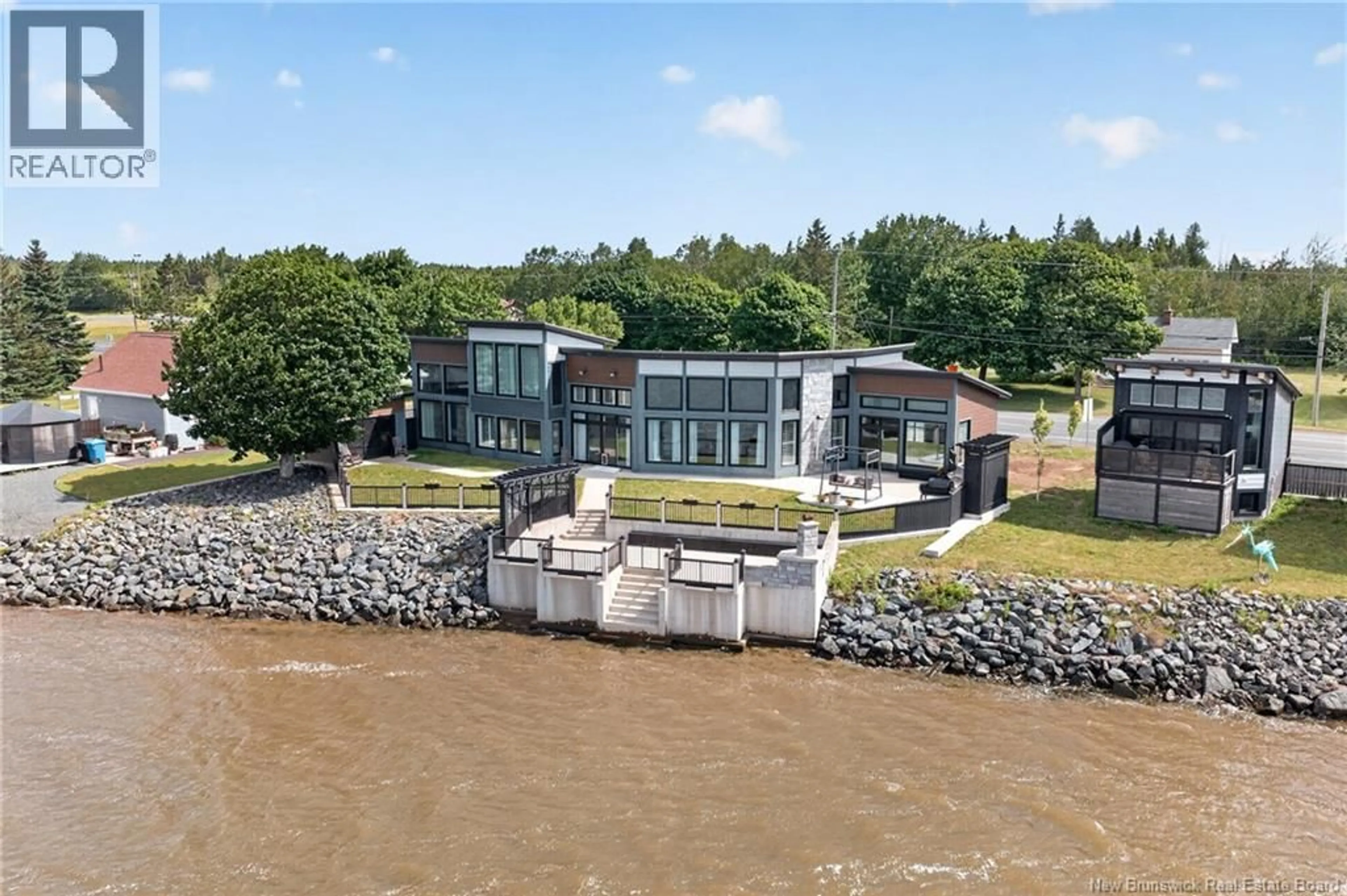 A pic from outside/outdoor area/front of a property/back of a property/a pic from drone, water/lake/river/ocean view for 3285 RUE PRINCIPALE, Tracadie New Brunswick E1X1A3