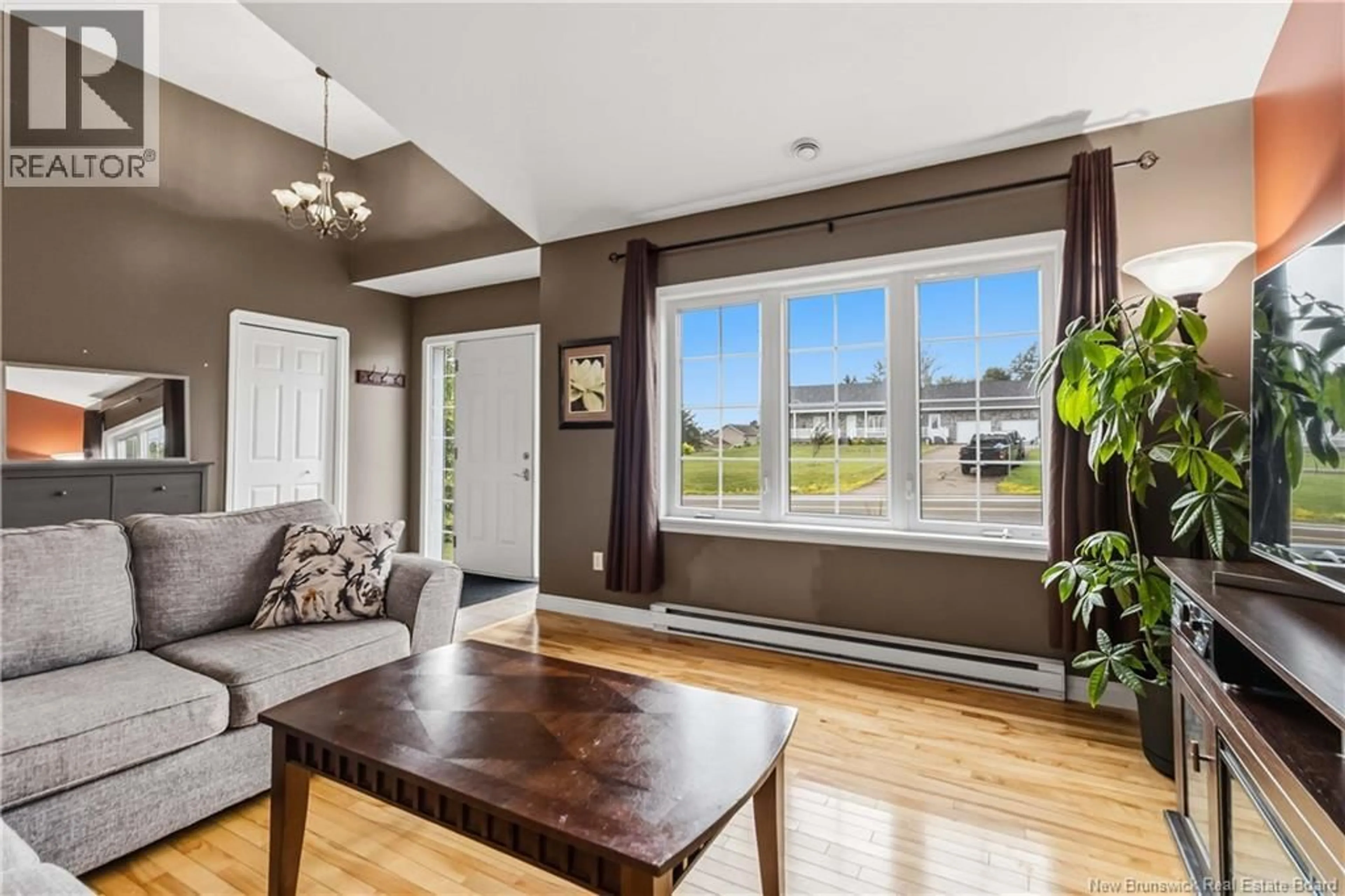 Living room with furniture, wood/laminate floor for 378 LEBLANC ROAD, Dieppe New Brunswick E1A7N4