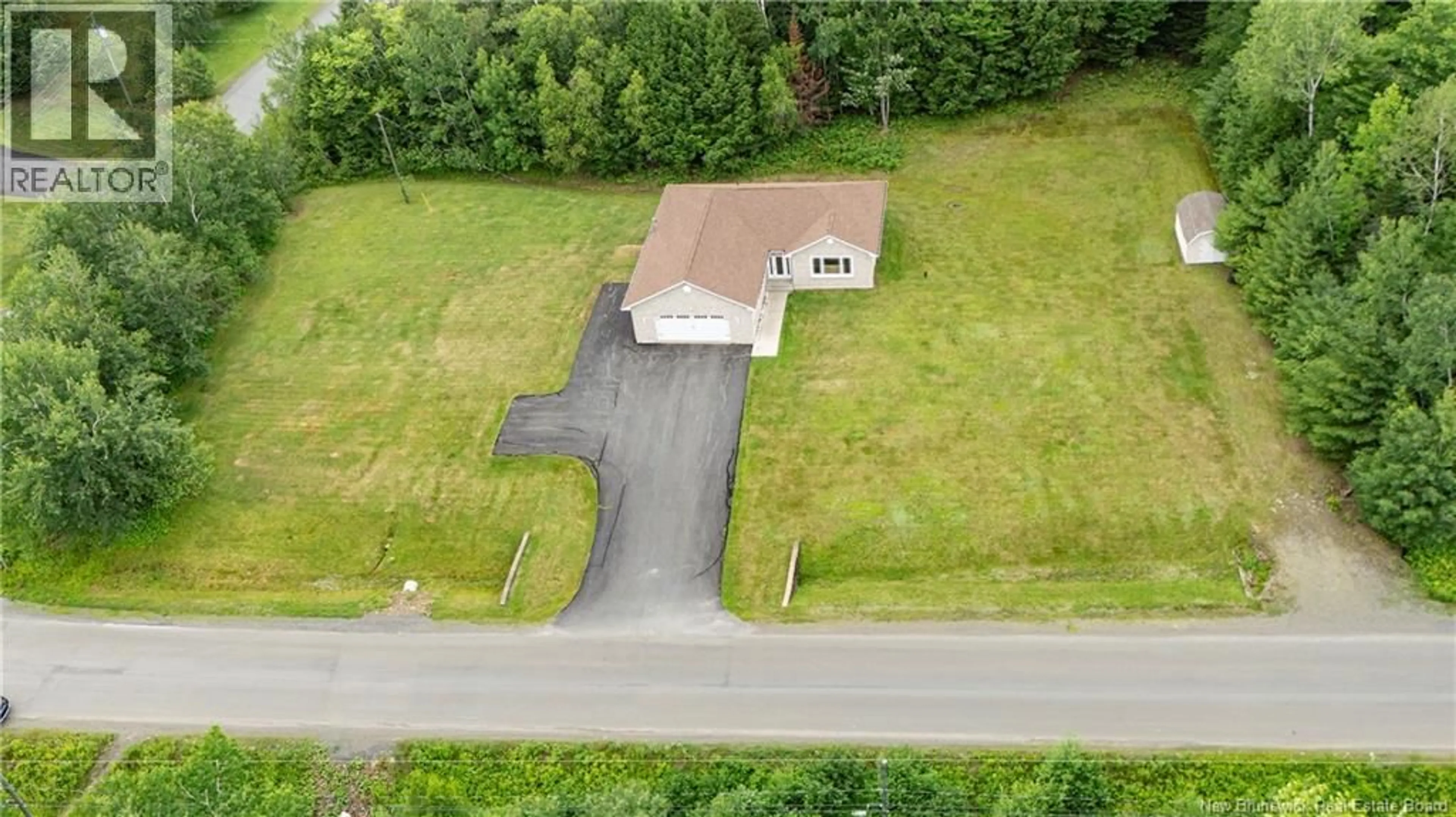 A pic from outside/outdoor area/front of a property/back of a property/a pic from drone, street for 180 ROCKWOOD WAY, Richibucto Road New Brunswick E3A9X3