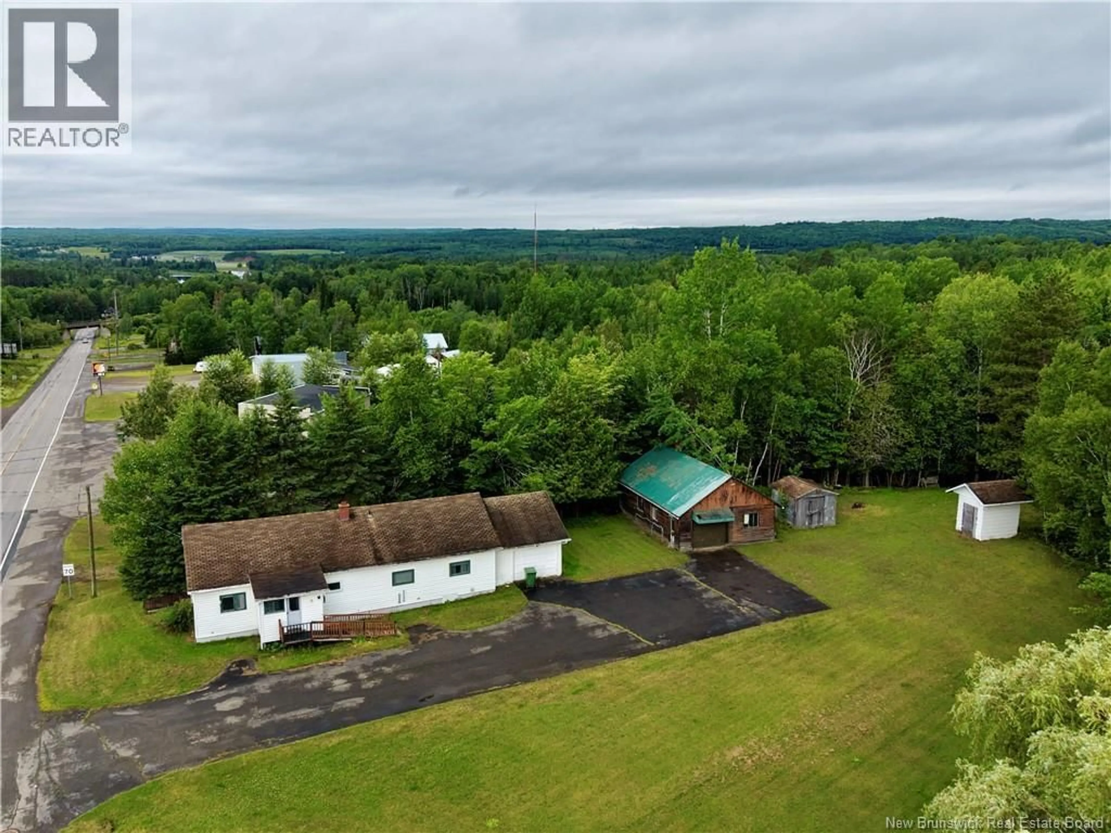 A pic from outside/outdoor area/front of a property/back of a property/a pic from drone, mountain view for 111 MAIN STREET, Plaster Rock New Brunswick E7G2H2