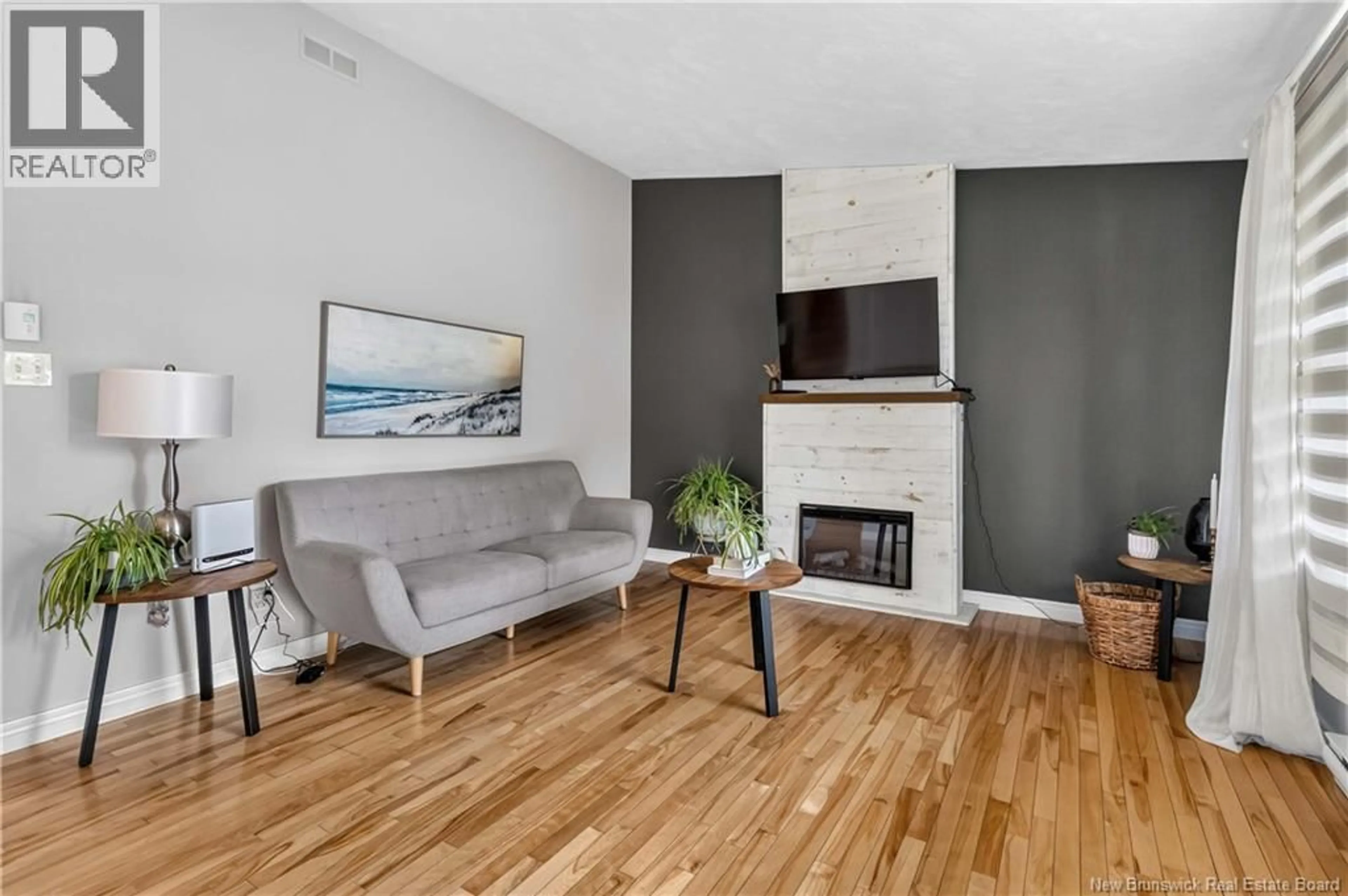 Living room with furniture, wood/laminate floor for 39 LOTUSROW DRIVE, Moncton New Brunswick E1E4W1