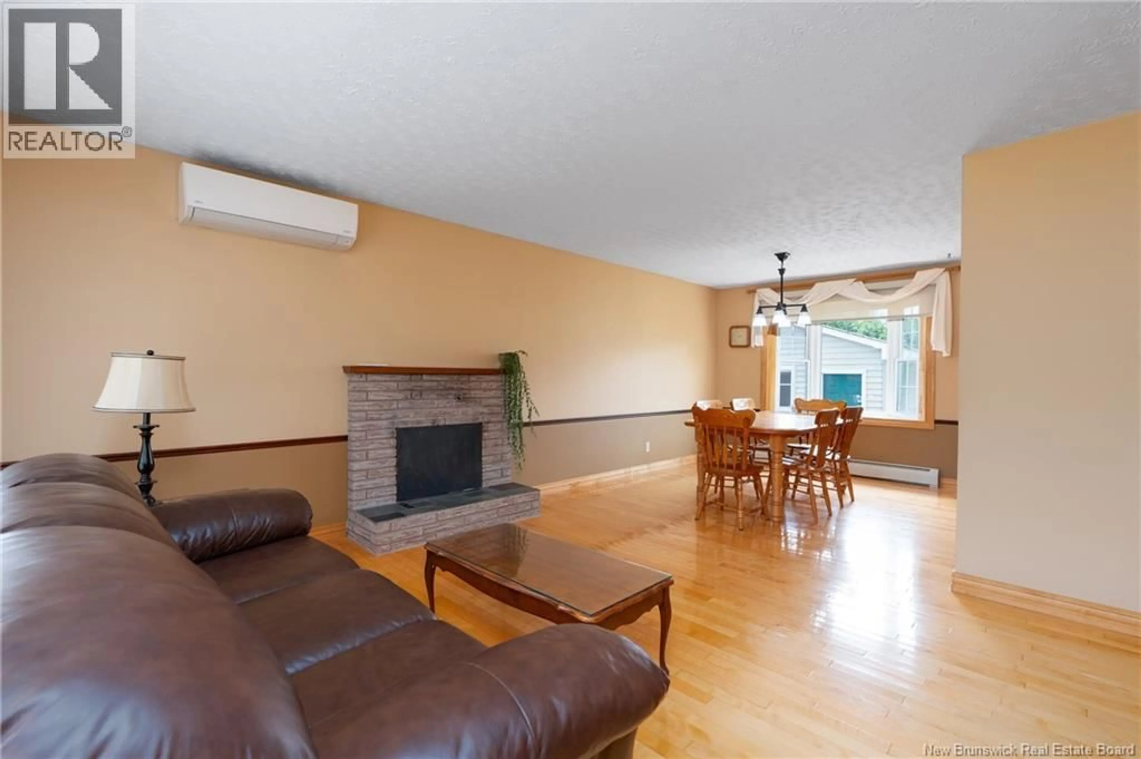 Living room with furniture, wood/laminate floor for 130 SUNRISE ESATES DRIVE, New Maryland New Brunswick E3C1G6