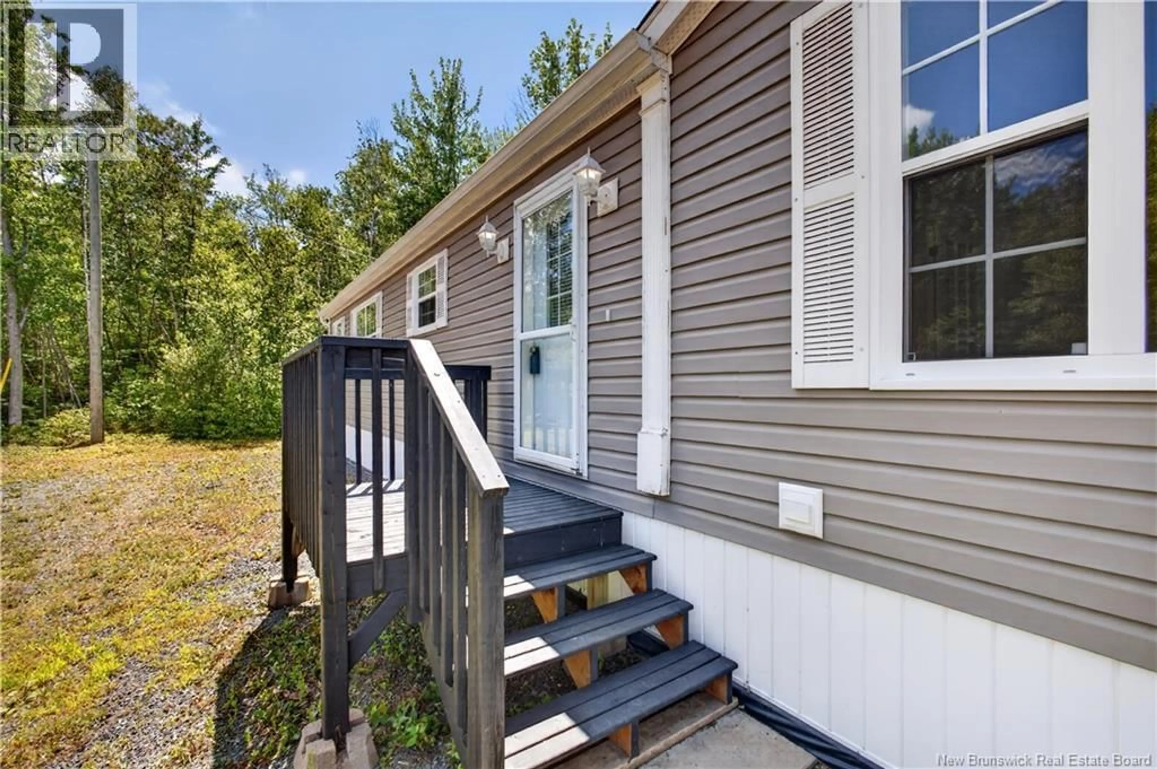 Home with vinyl exterior material, street for 415 ROUTE 420, South Esk New Brunswick E1V4L9