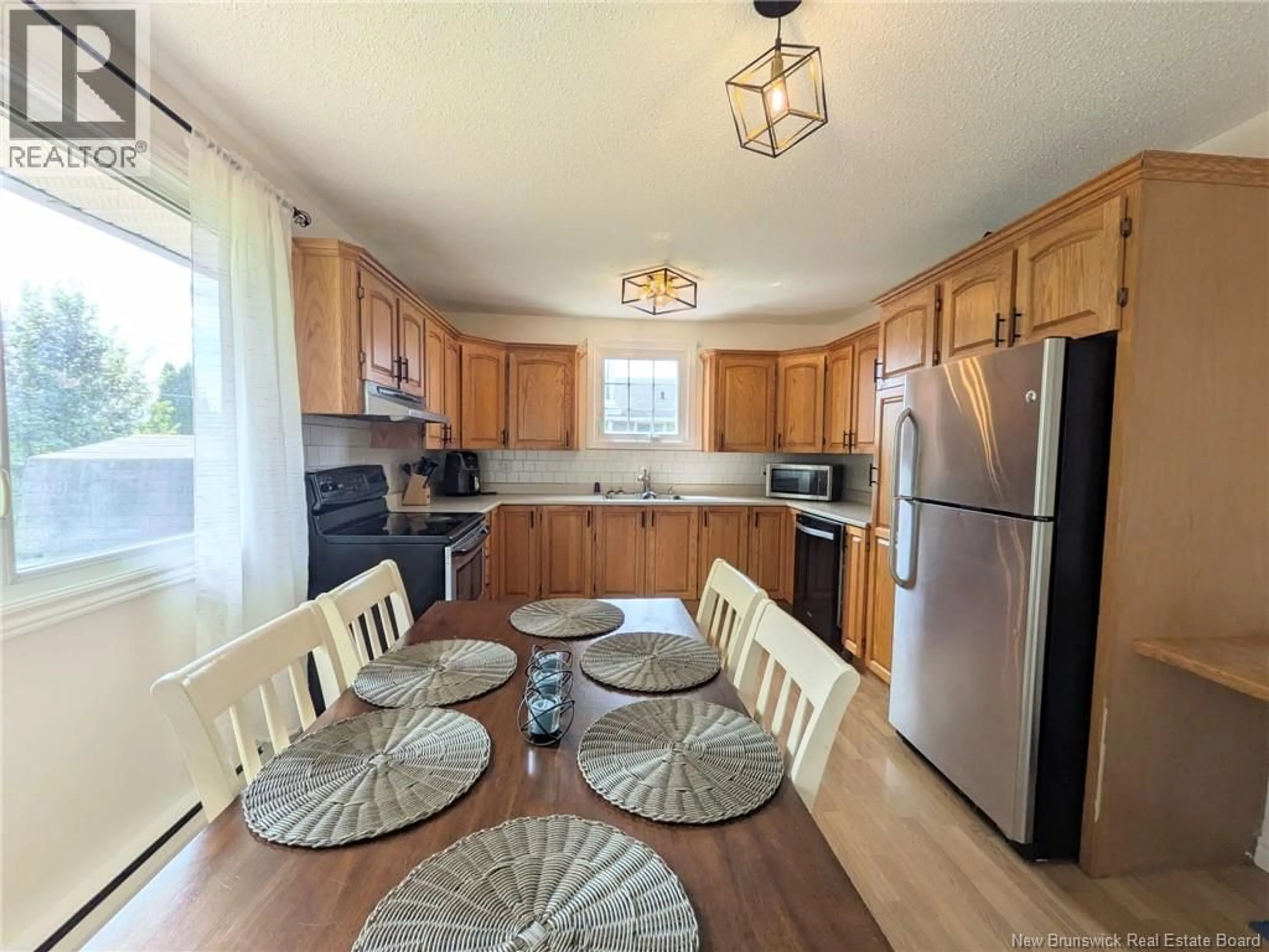 Open concept kitchen, wood/laminate floor for 8 BRAMALEA STREET, Miramichi New Brunswick E1N3B6