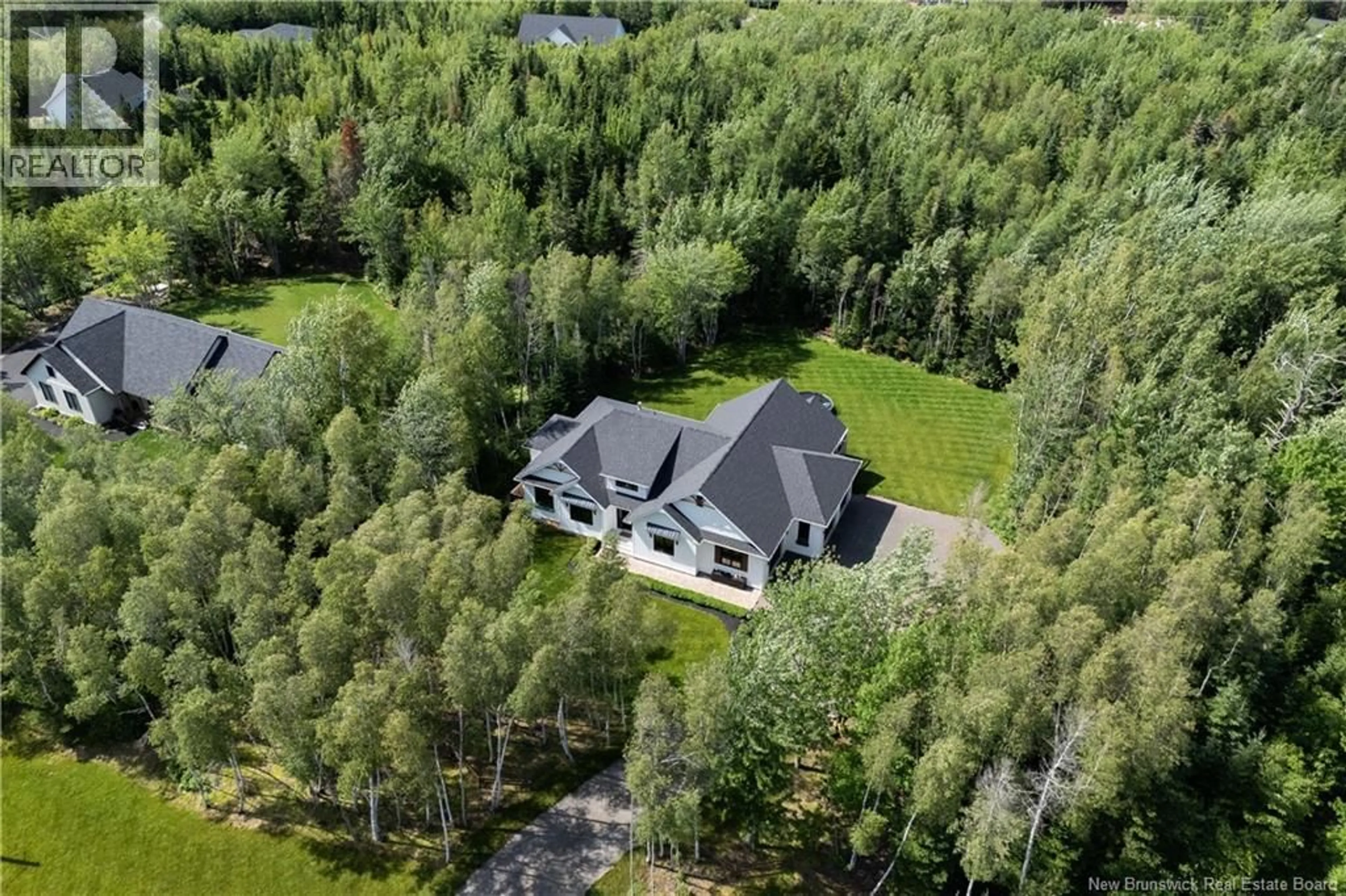 A pic from outside/outdoor area/front of a property/back of a property/a pic from drone, forest/trees view for 18 MESANGE COURT, Greater Lakeburn New Brunswick E1H0N4