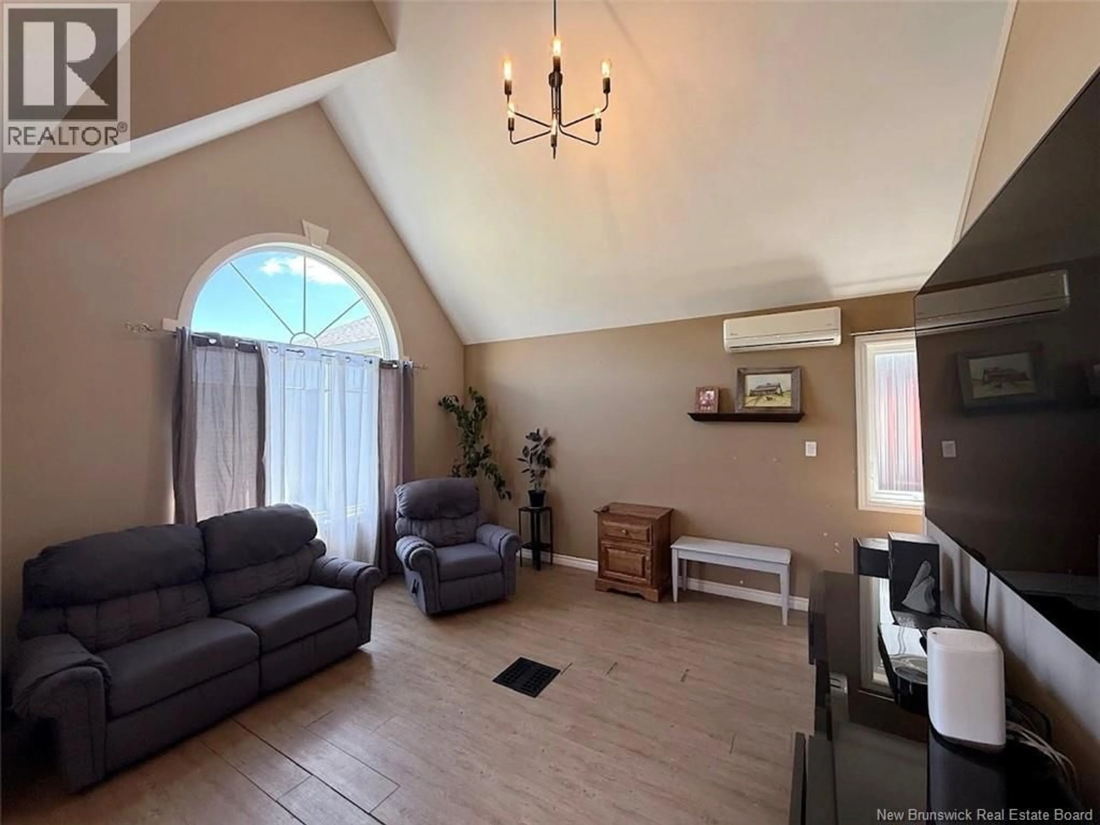 Living room with furniture, wood/laminate floor for 353 ROUSSEL ET MARTIN ROAD, Saint-Joseph-De-Madawaska New Brunswick E7B2R6