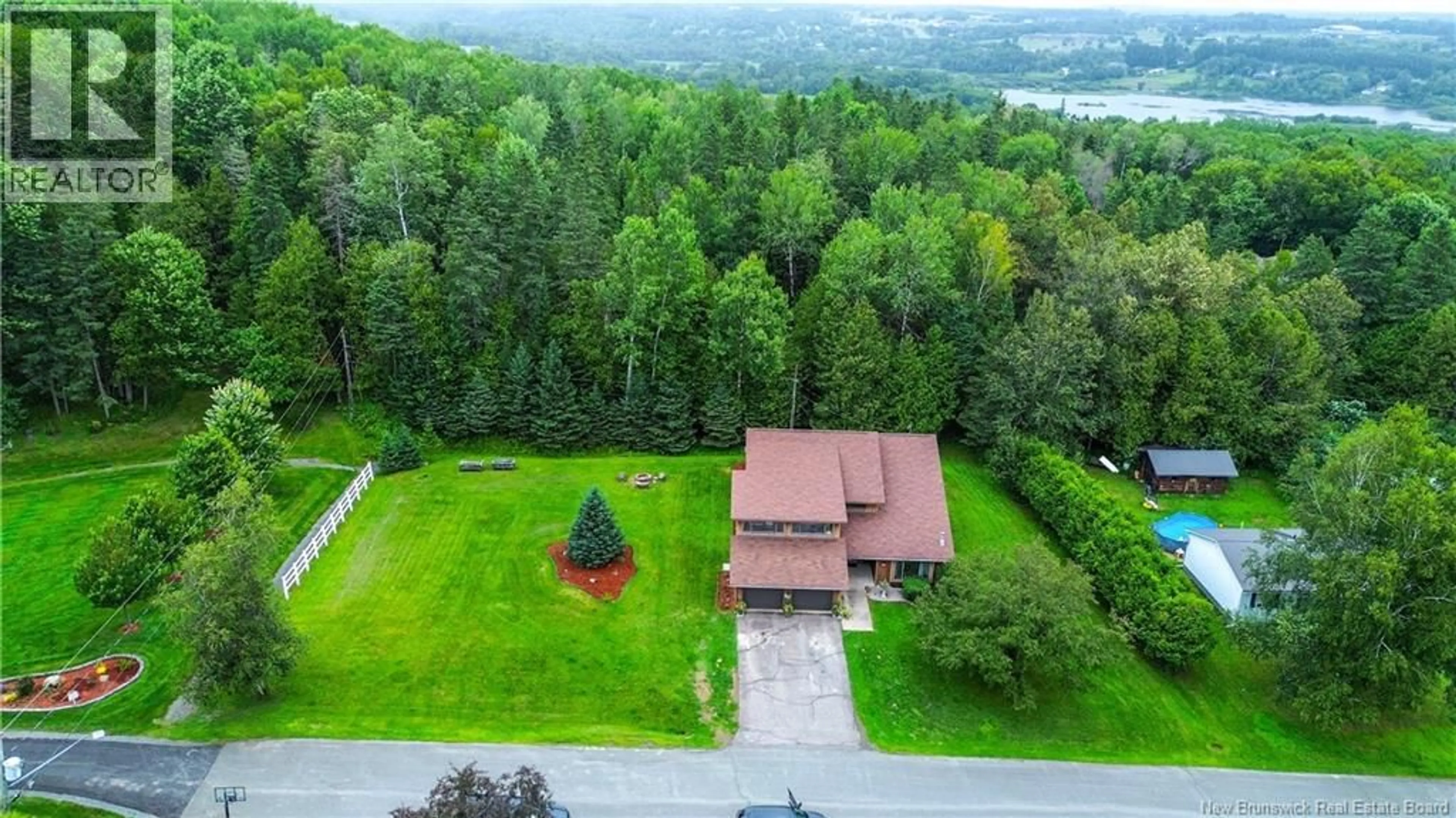 A pic from outside/outdoor area/front of a property/back of a property/a pic from drone, forest/trees view for 130 HENRY STREET, Woodstock New Brunswick E7M1Y1