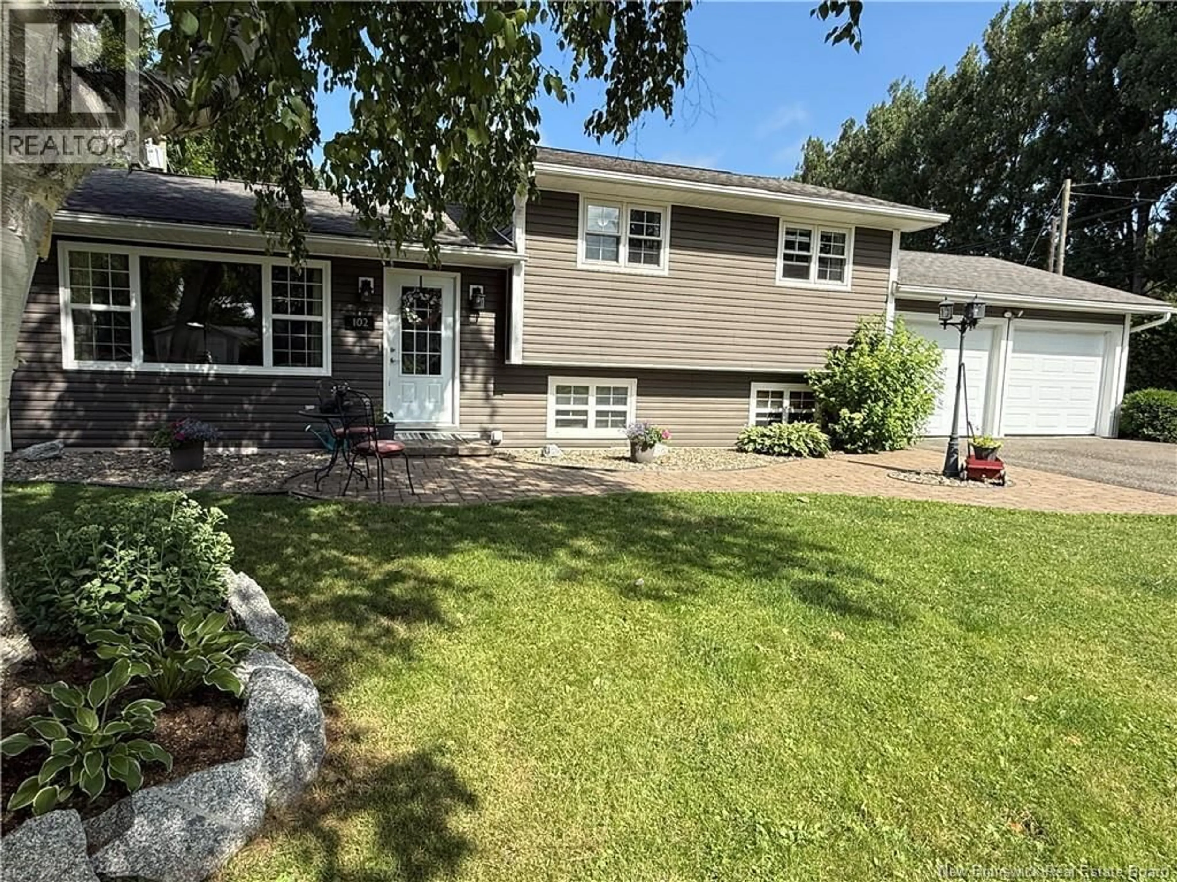 Home with vinyl exterior material, street for 102 SCOTT STREET, Woodstock New Brunswick E7M2P9
