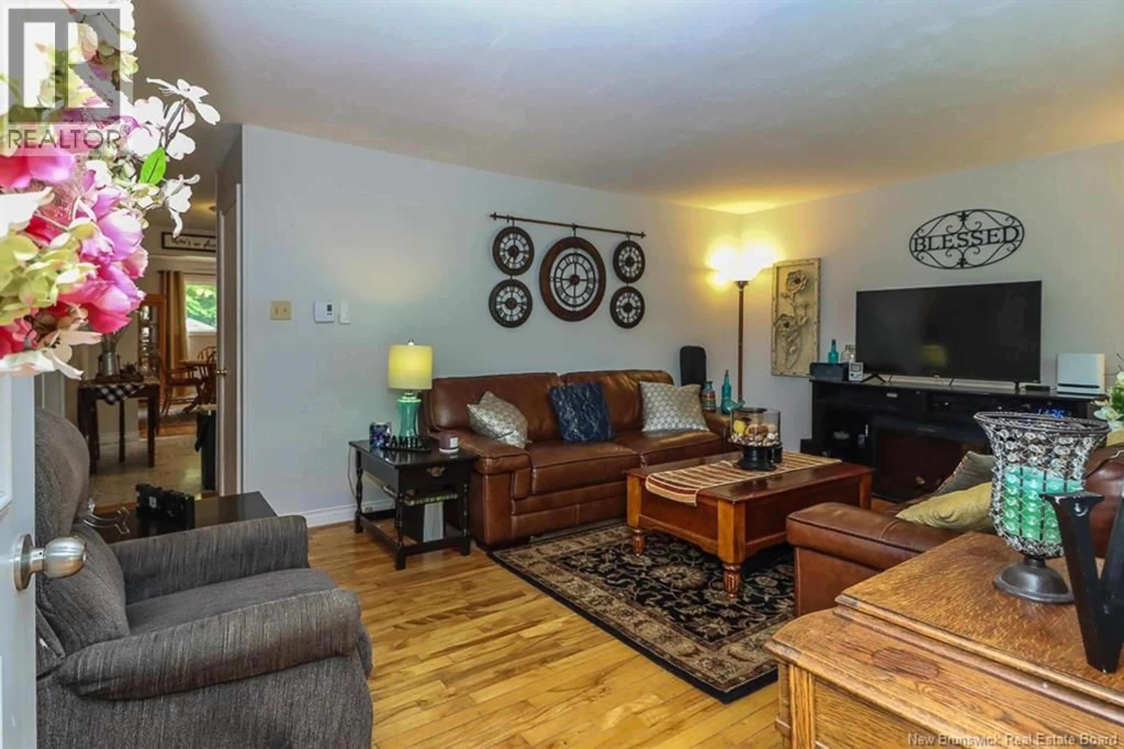 Living room with furniture, wood/laminate floor for 3 FAIRMONT DRIVE, Hampton New Brunswick E5N7E4